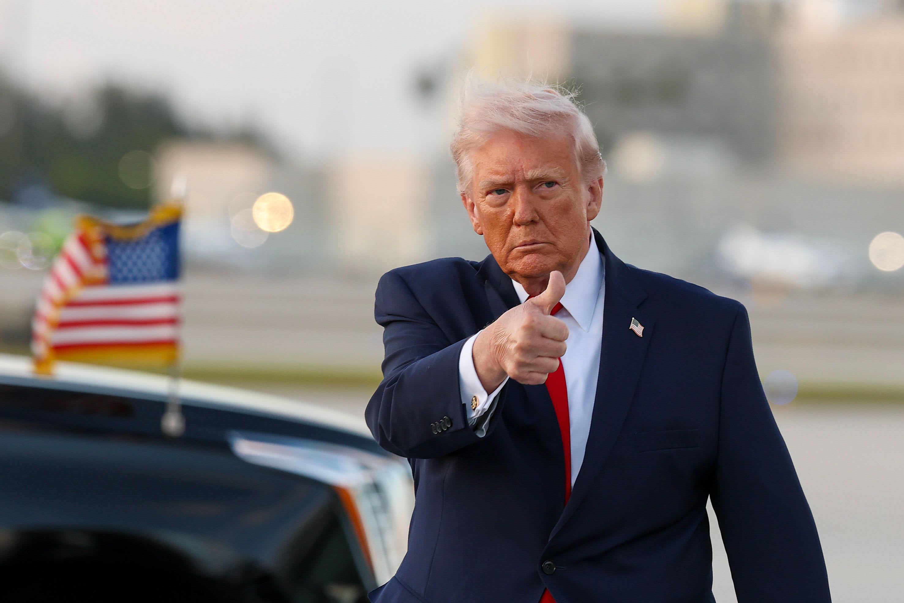 US President Donald Trump waves to the media after walking off of Air Force One at Miami International Airport on April 11, 2026 in Miami, Florida. (photo credit: Tasos Katopodis/Getty Images)