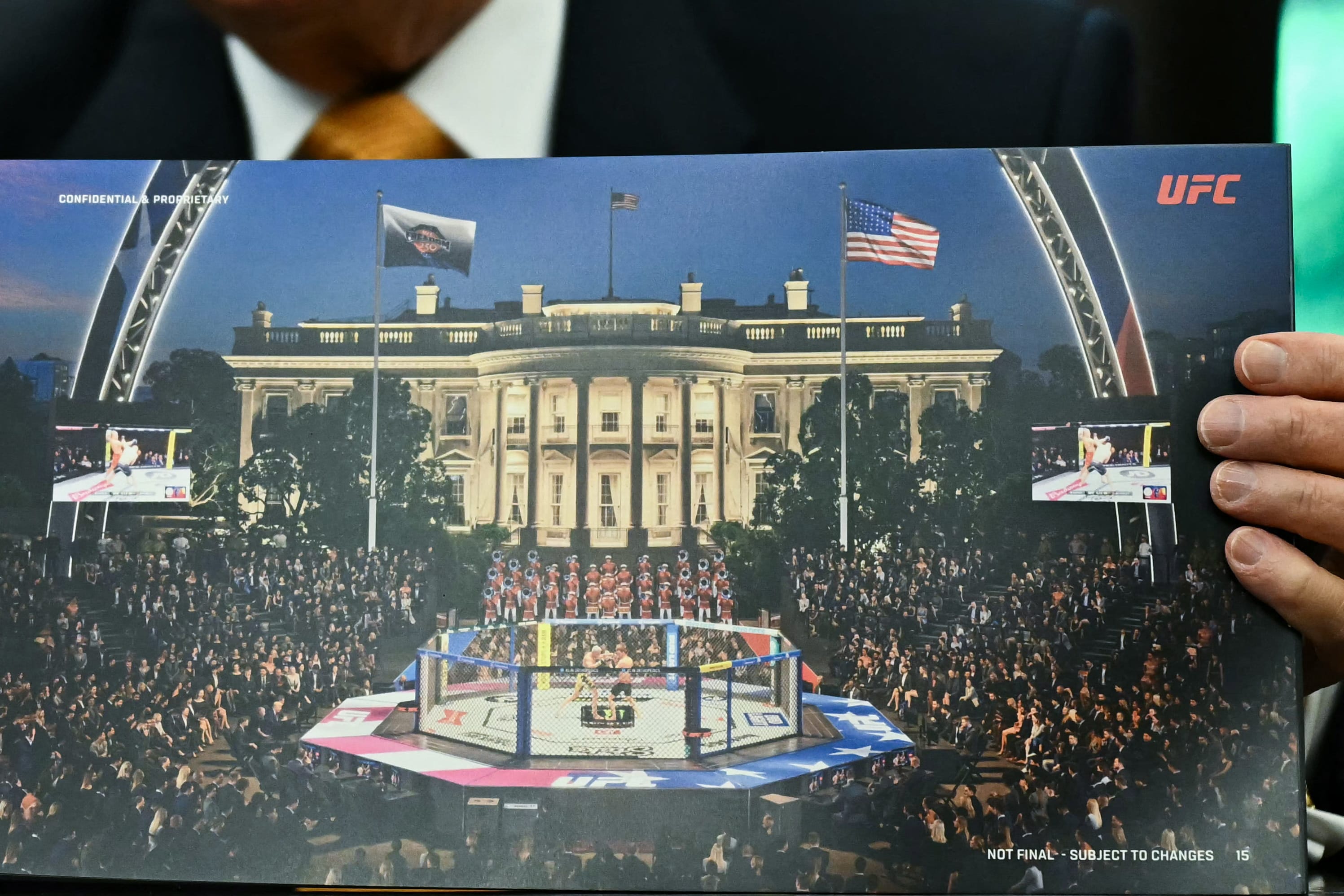 US President Donald Trump shows a rendering of the upcoming "UFC Freedom 250" event as he speaks in the Oval Office of the White House on May 6, 2026, in Washington, DC. An Ultimate Fighting Championship event will be staged on the White House