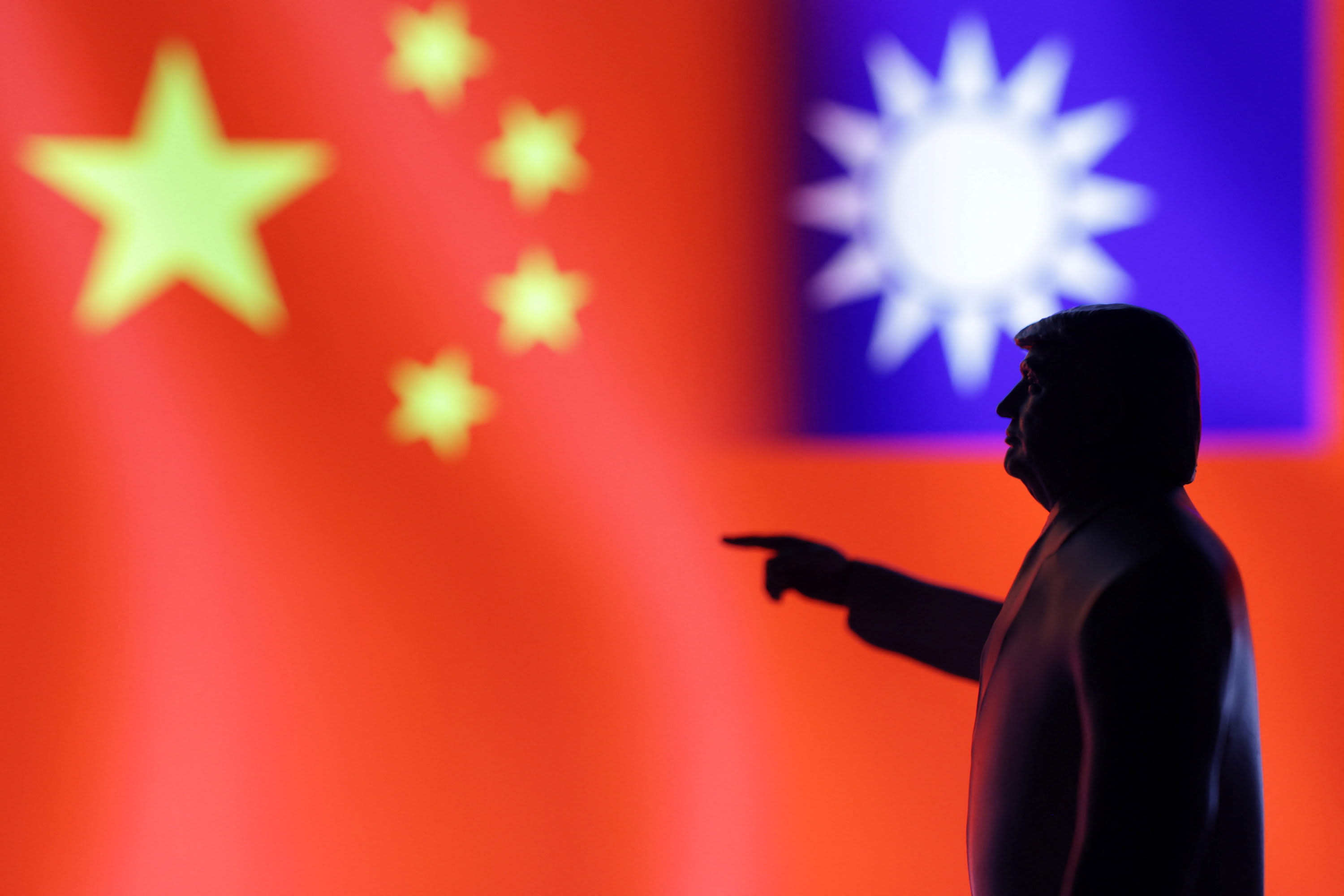 A 3D-printed miniature model depicting US President Donald Trump, Chinese flag and fragment of Taiwanese flag in this illustration taken, April 17, 2025. (photo credit: REUTERS/DADO RUVIC/ILLUSTRATION)