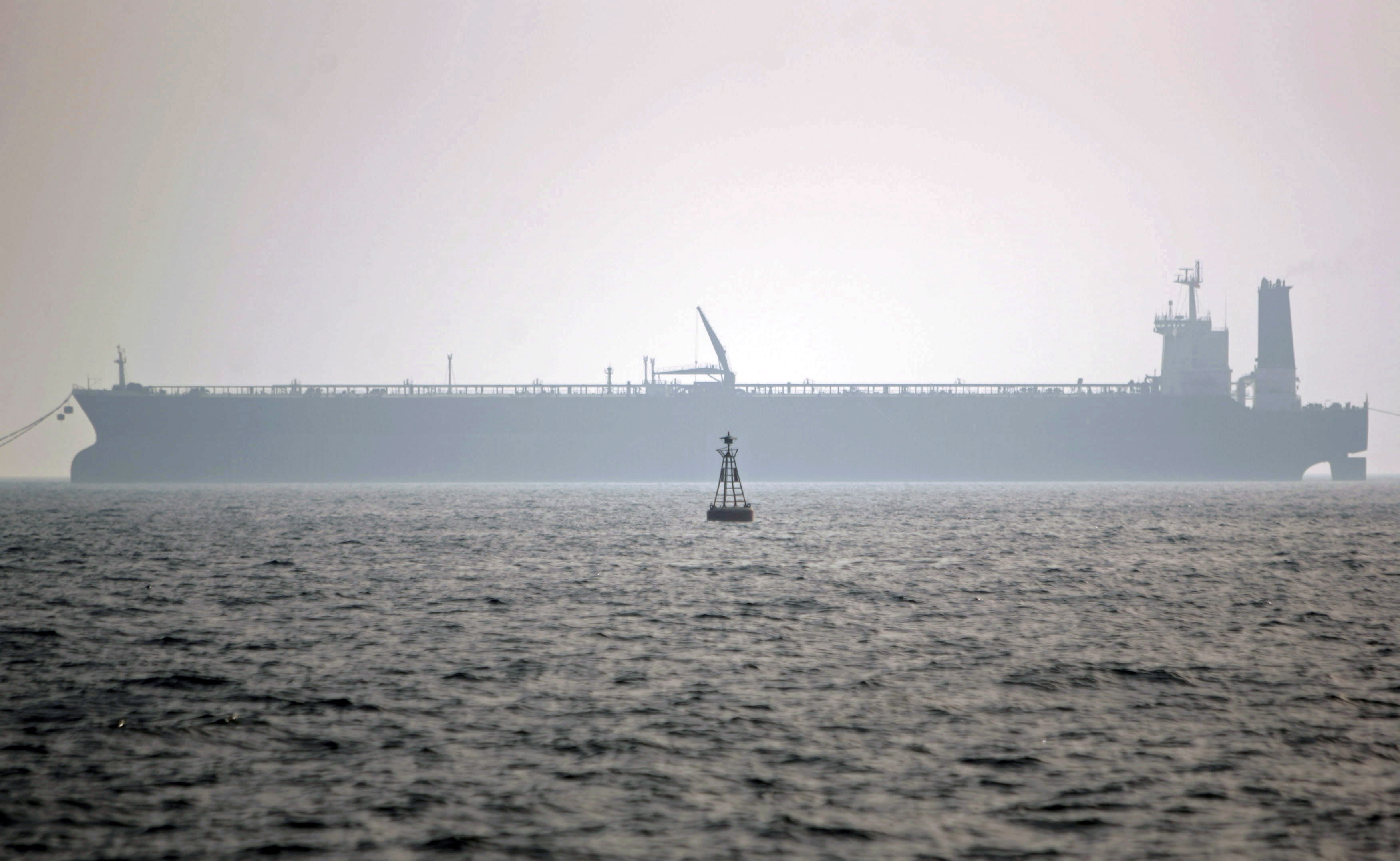 An oil tanker loads gas in Assaluyeh seaport at the Persian Gulf, 1,400 km (870 miles) south of Tehran, Iran May 27, 2006. (photo credit: MORTEZA NIKOUBAZI/ REUTERS)