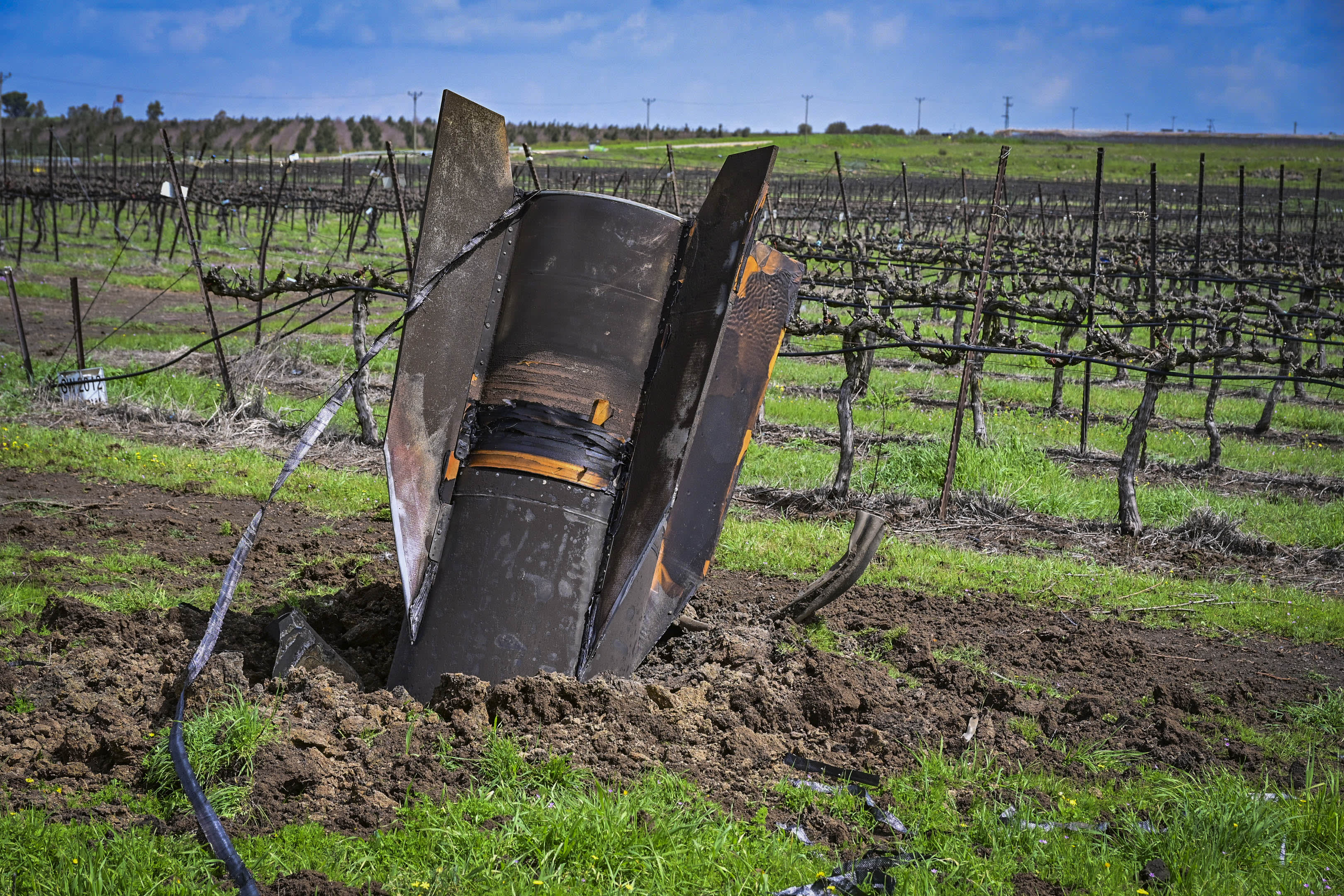 A fragment of an Iranian ballistic missile intercepted by Israeli air defense systems is seen lodged in the ground in the Golan Heights, March 19, 2026 (photo credit: MICHAEL GILADI/FLASH90)