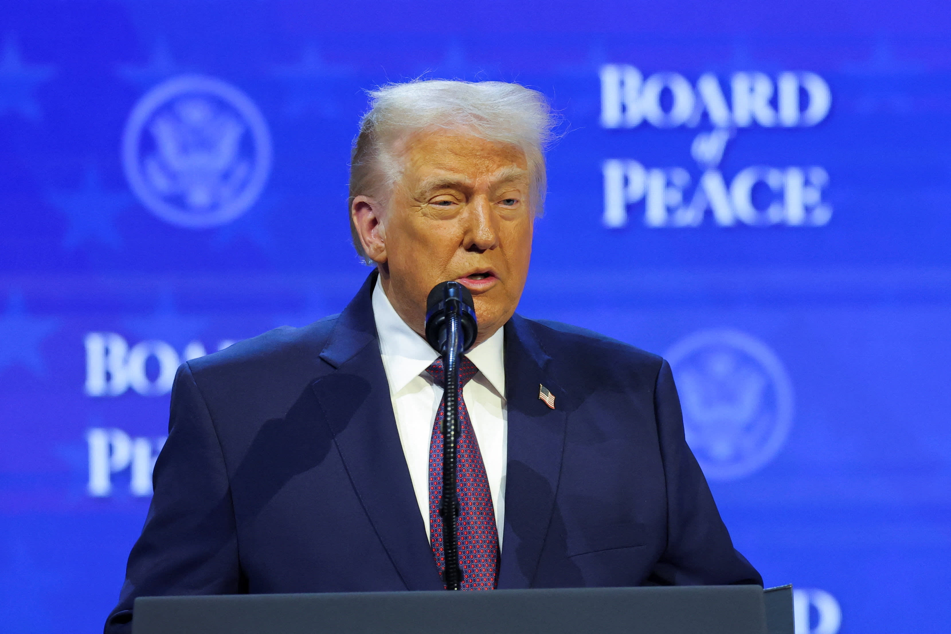 U.S. President Donald Trump takes part in a charter announcement for his Board of Peace initiative aimed at resolving global conflicts, alongside the 56th annual World Economic Forum (WEF), in Davos, Switzerland, January 22, 2026.  (photo credit: REUTERS/DENIS BALIBOUSE)
