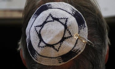 Head with Israeli flag kippa (photo credit: REUTERS/Ina Fassbender)