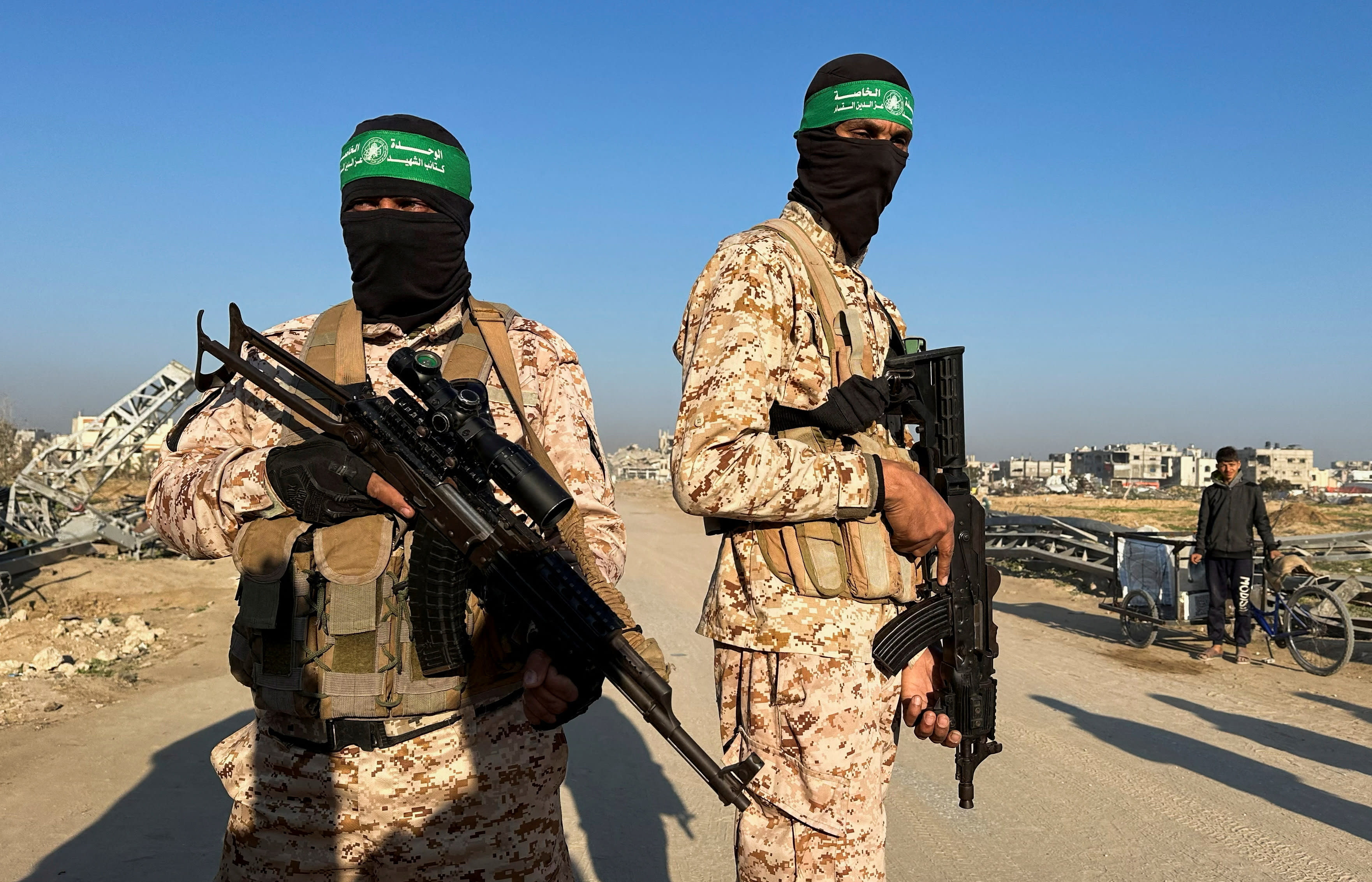 Hamas terrorists in Khan Yunis in southern Gaza ahead of the hostage release. January 30, 2025. (photo credit: REUTERS/Hatem Khaled)