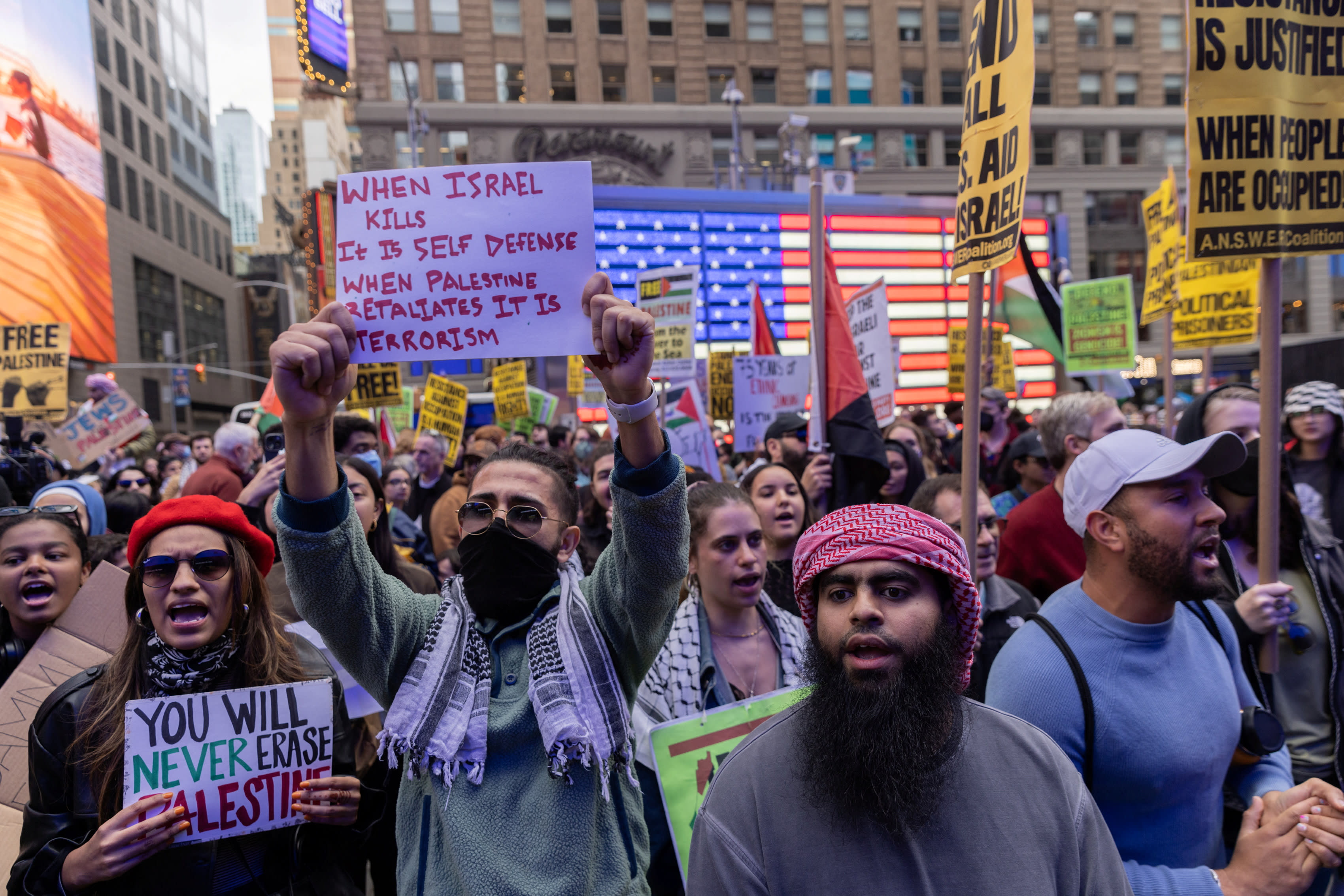  Pro-Palestinian demonstrators protest in Times Square on the second day of the ongoing conflict between Israel and the Palestinian militant group Hamas, in Manhattan in New York City, U.S., October 8, 2023 (photo credit: JEENAH MOON/REUTERS)