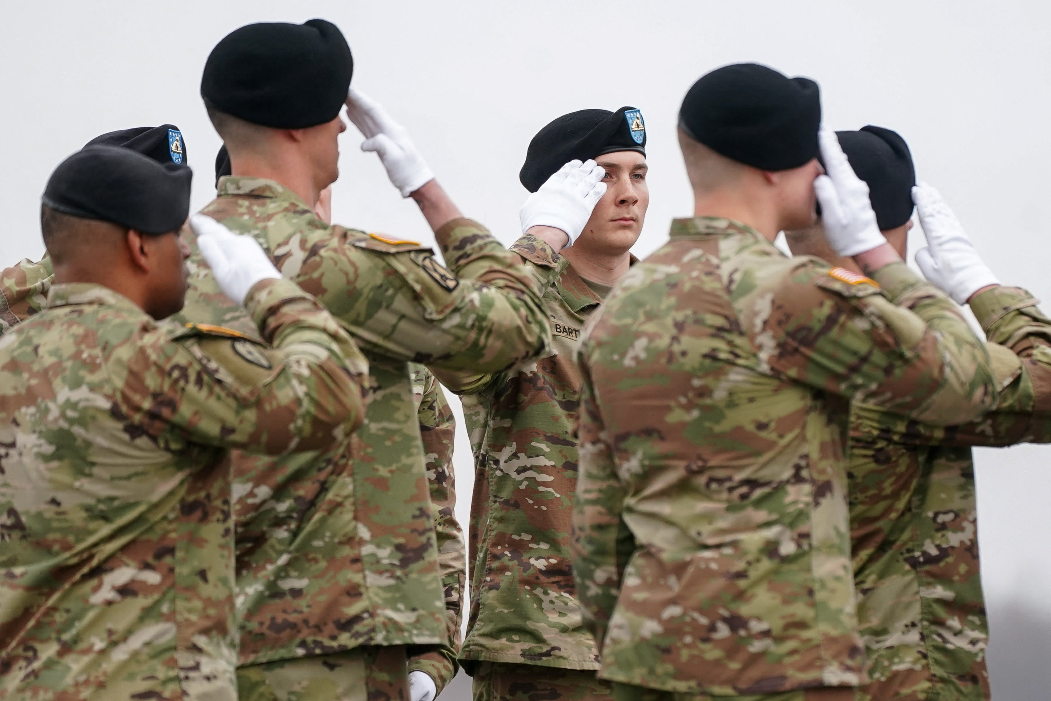 Members of the military salute during a dignified transfer of the remains of six US Army service members of the 103rd Sustainment Command, who were killed in Kuwait, at Dover Air Force Base in Dover, Delaware, US, March 7, 2026. (photo credit: REUTERS/Nathan Howard)