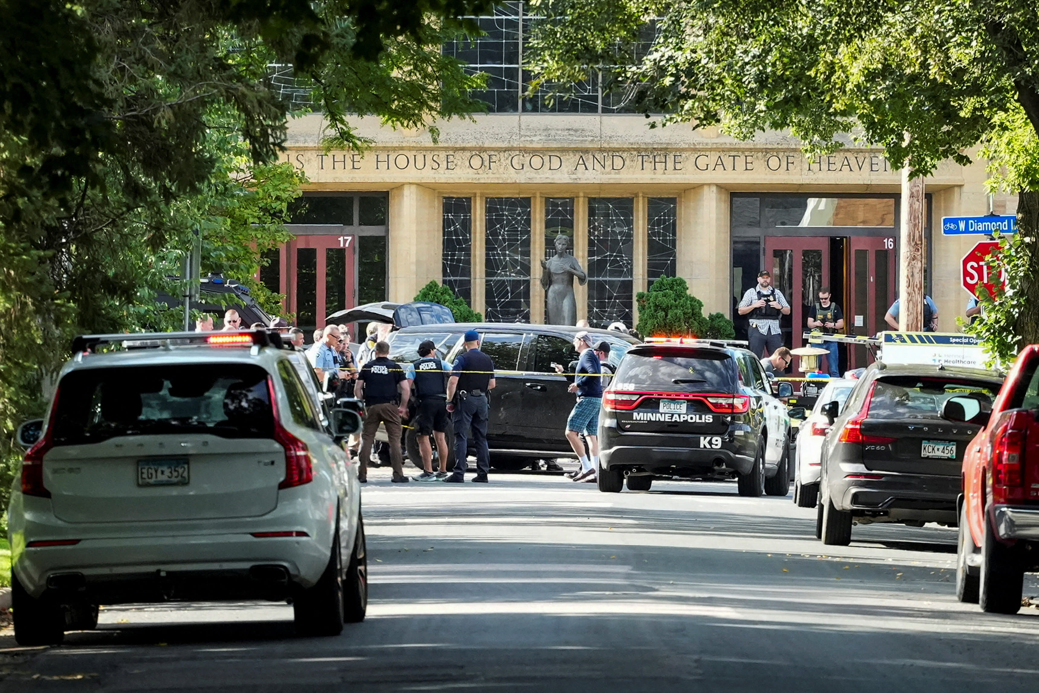 Law enforcement officers gather outside Annunciation Church following a mass shooting event, in Minneapolis, Minnesota, US, August 27, 2025. (photo credit: REUTERS/Tim Evans)
