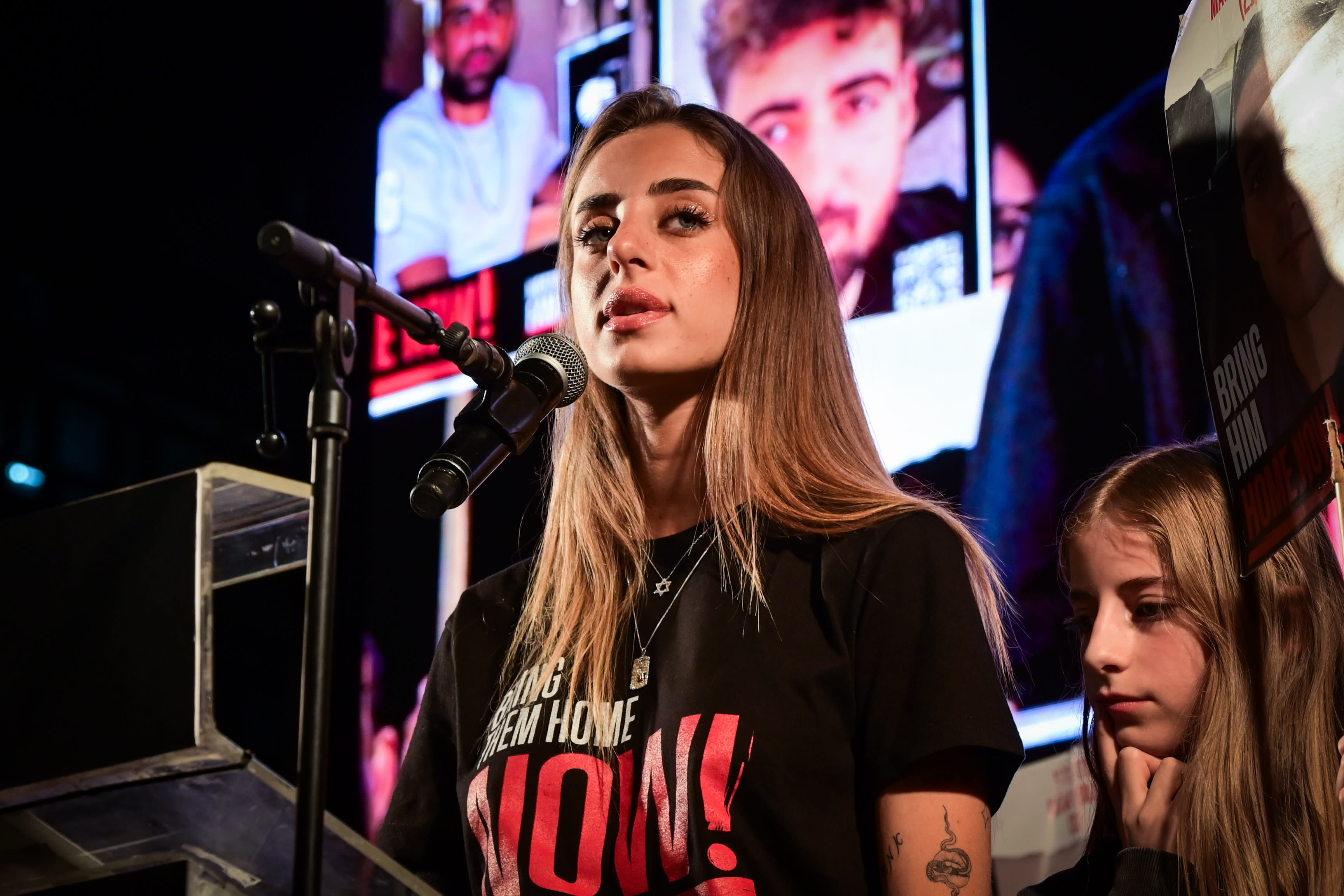 Former hostage Mia Schem speaks during a rally calling for the release of Israelis held hostage by Hamas terrorists in Gaza at Hostages Square, Tel Aviv, May 17, 2025; illustrative. (photo credit: AVSHALOM SASSONI/FLASH90)