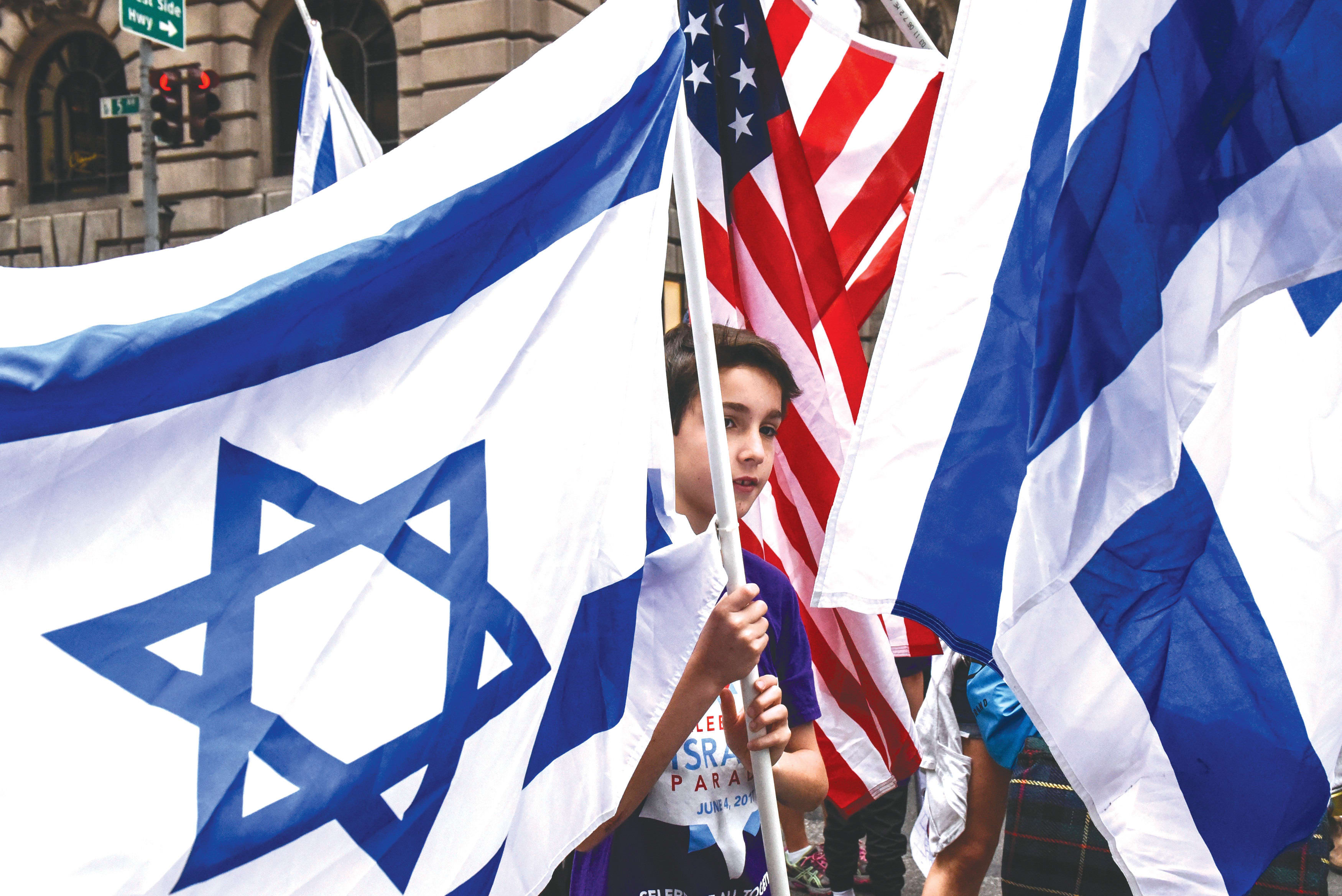  CELEBRATING ISRAEL during a New York parade. What does Chabad have against the flag? (photo credit: STEPHANIE KEITH/REUTERS)
