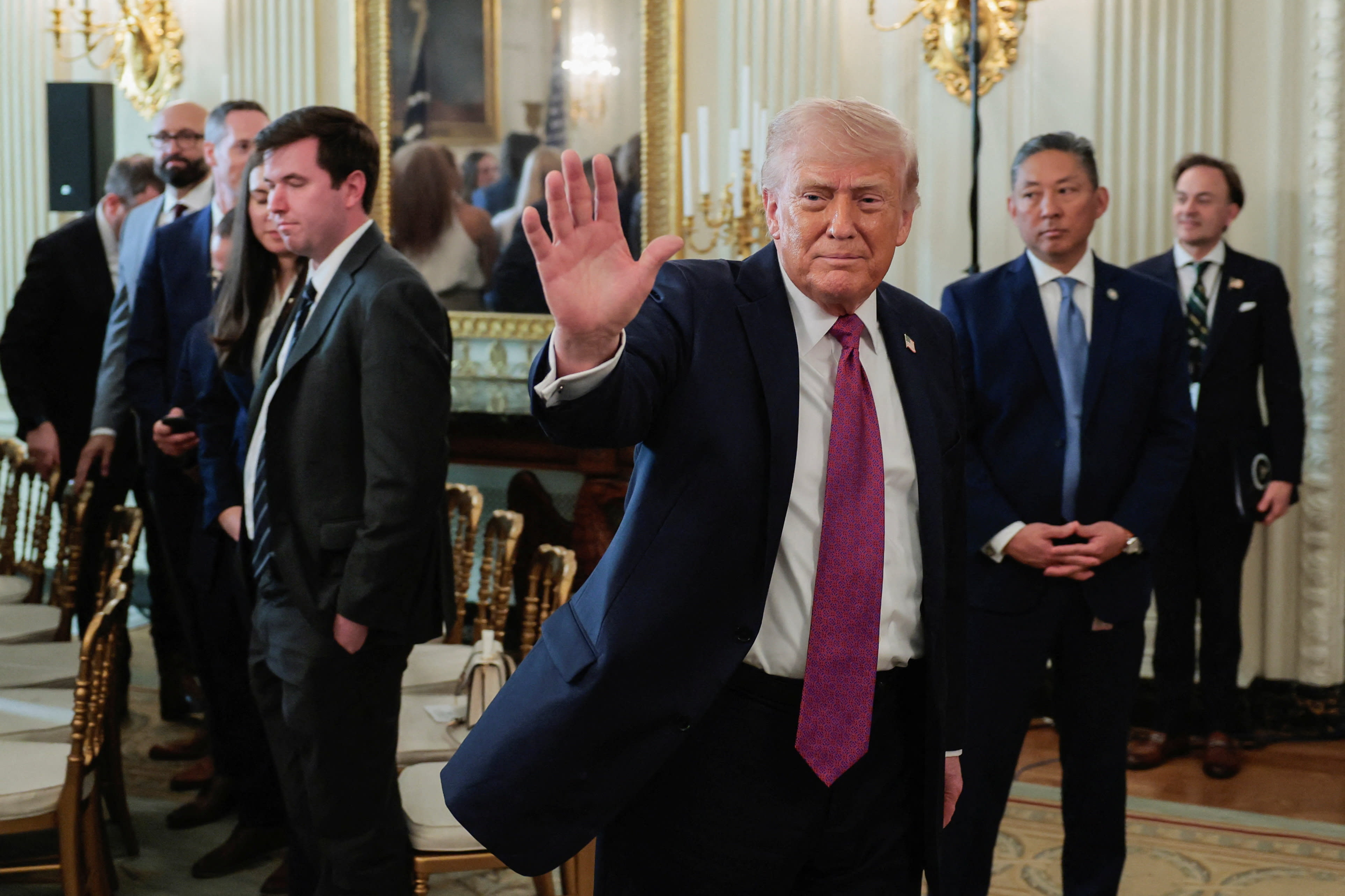   US President Donald Trump waves as he departs after delivering remarks to NCAA Collegiate National Champions in the State Dining Room at the White House in Washington, DC, US., April 21, 2026.  (photo credit:  REUTERS/Kylie Cooper)