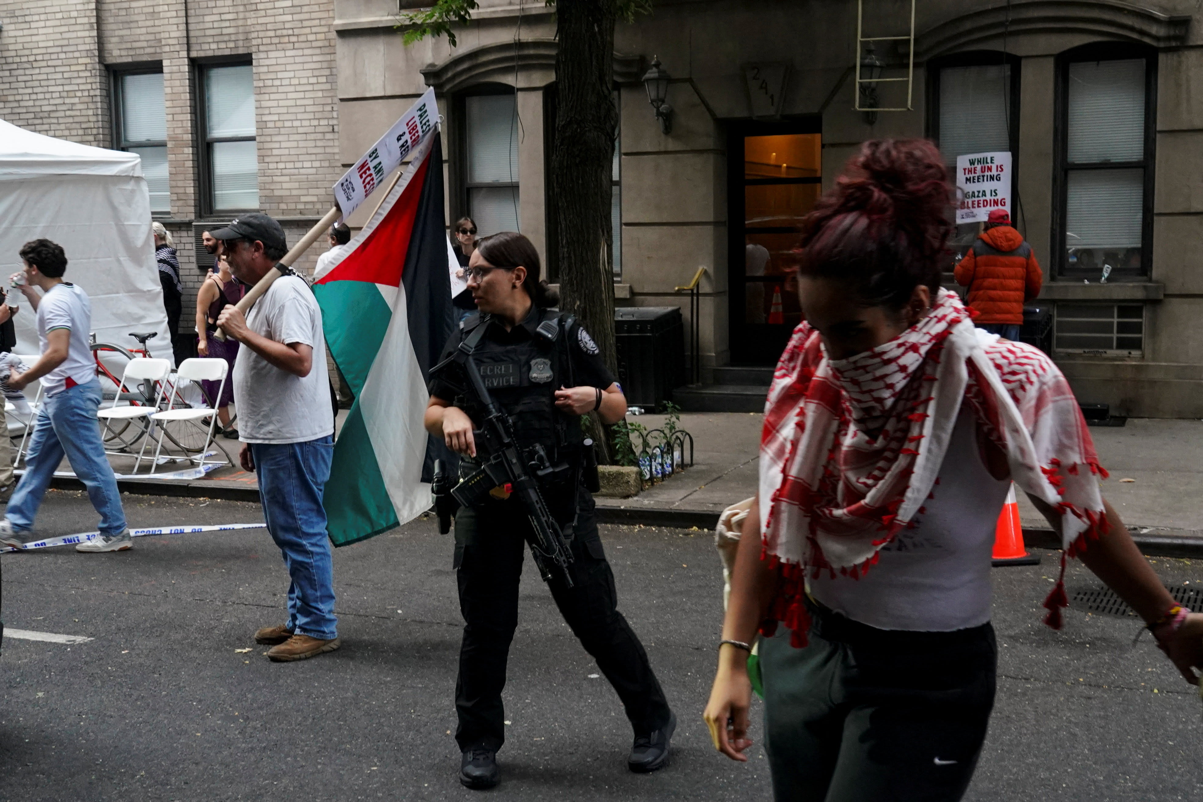 An armed member of the US Secret Service looks on as Pro-Palestinian demonstrators take part in the "National March on NYC for Gaza", organized by Palestinian-led community organization Within Our Lifetime (WOL), September 23, 2025 (photo credit: BING GUAN/REUTERS)