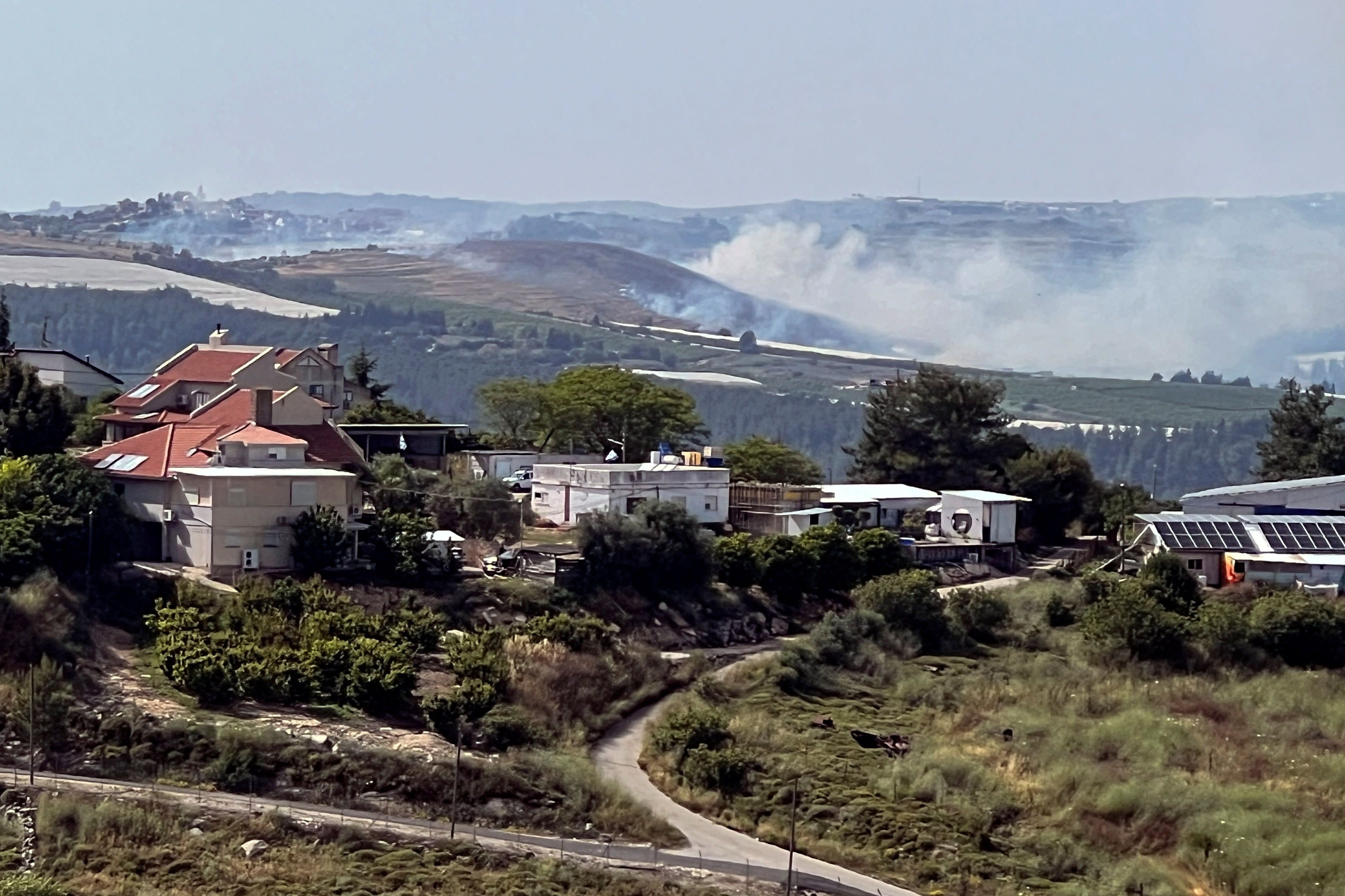  Smoke billows over northern Israel after rockets were fired from Lebanon, amid ongoing cross-border hostilities between Hezbollah and Israeli forces, by Israel