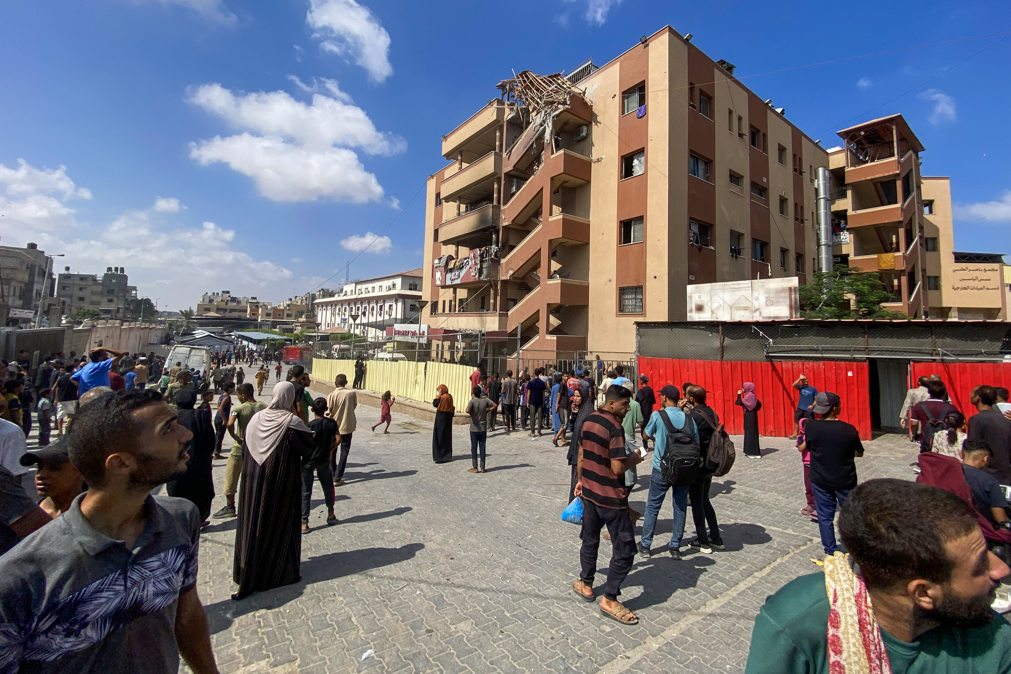 Crowds gather in the aftermath of an Israeli strike on Khan Yunis