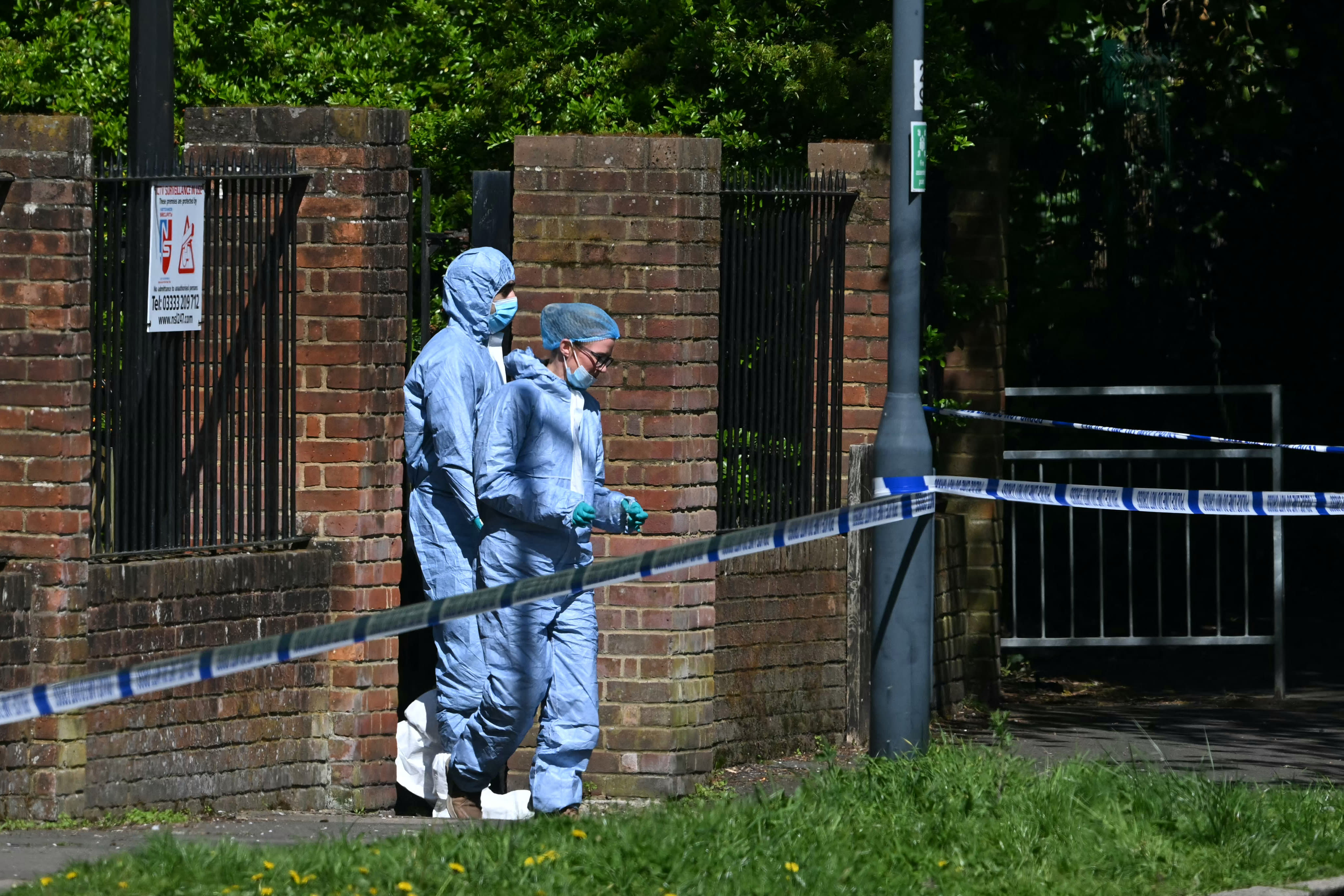 Police forensic officers work inside a cordon set up near to Kenton United Synagogue in Harrow, north-west London on April 19, 2026, the scene of an arson attack overnight. (photo credit: JUSTIN TALLIS / AFP via Getty Images)