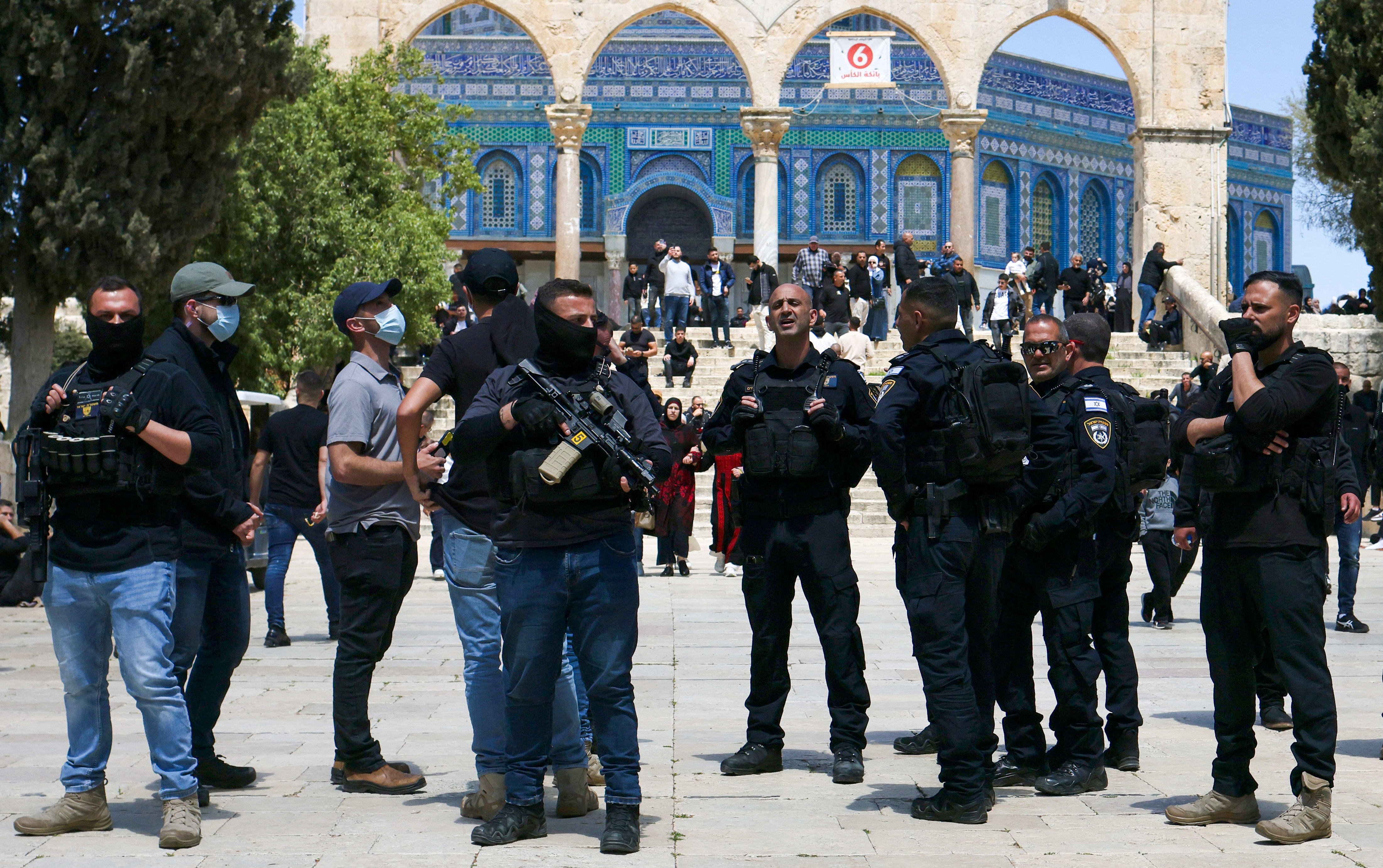 Israeli security personnel arrive as Muslim worshippers gather outside the Dome of the Rock within the Al-Aqsa Mosque compound for Friday noon prayers in the Old City of Jerusalem on April 10, 2026. (photo credit: AHMAD GHARABLI / AFP)