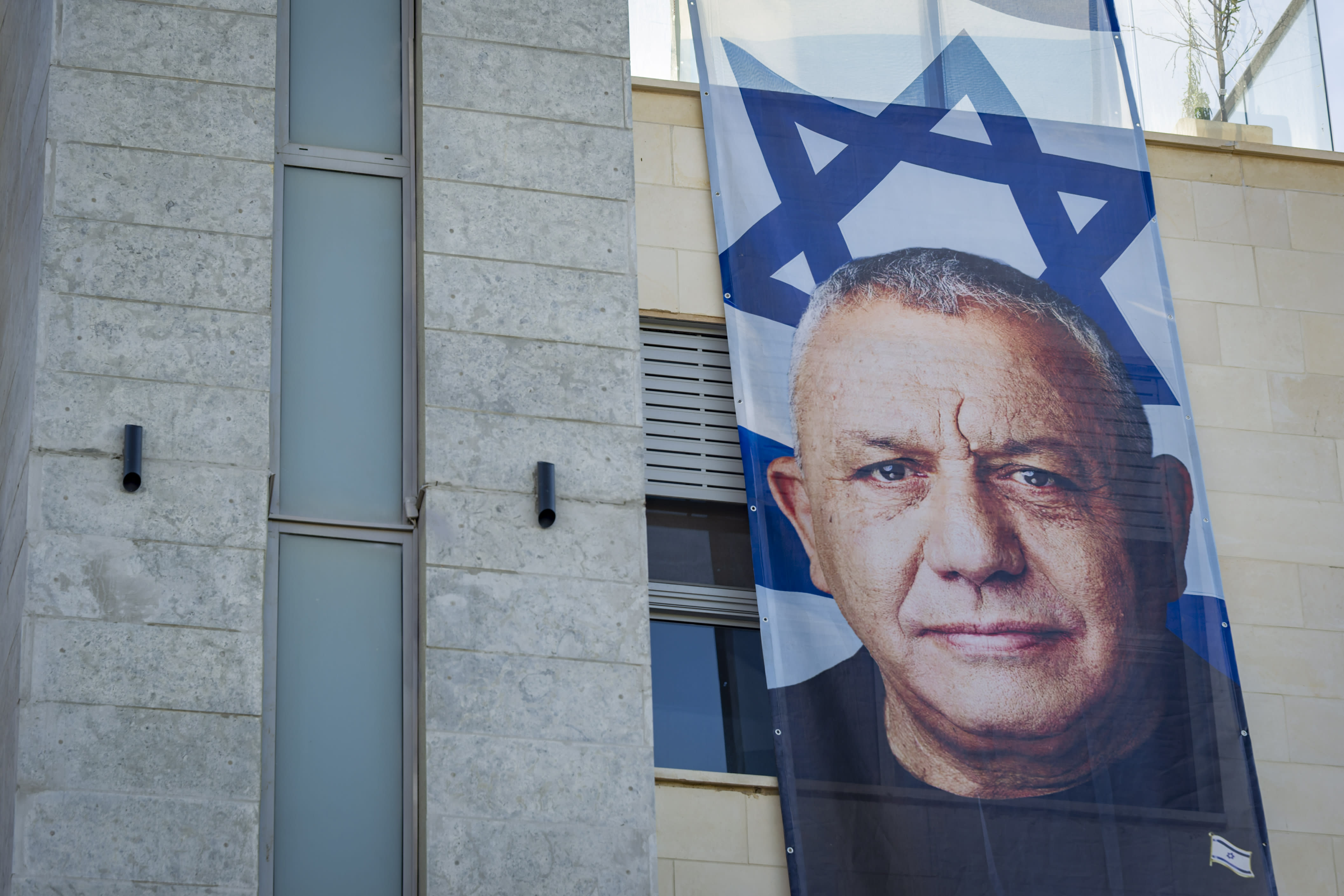 A large election campaign banner featuring Yashar party chairman Gadi Eisenkot is displayed on a building in the northern Israeli city of Haifa, October 18, 2026 (photo credit: Sharon Leibel/Flash90)