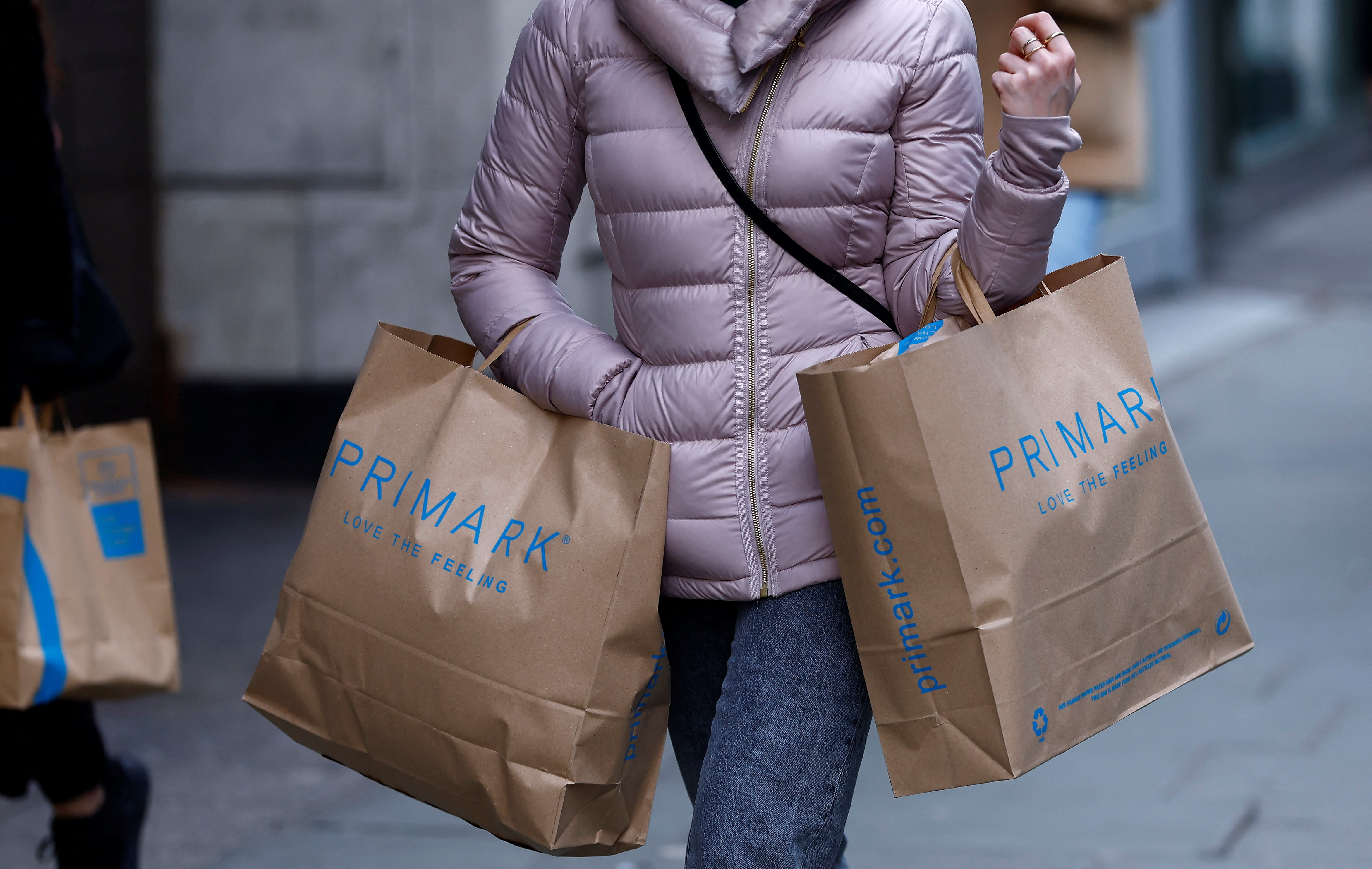  A woman carries Primark shopping bags on Oxford Street, in London, Britain, January 16, 2023.  (photo credit: REUTERS/PETER NICHOLLS)