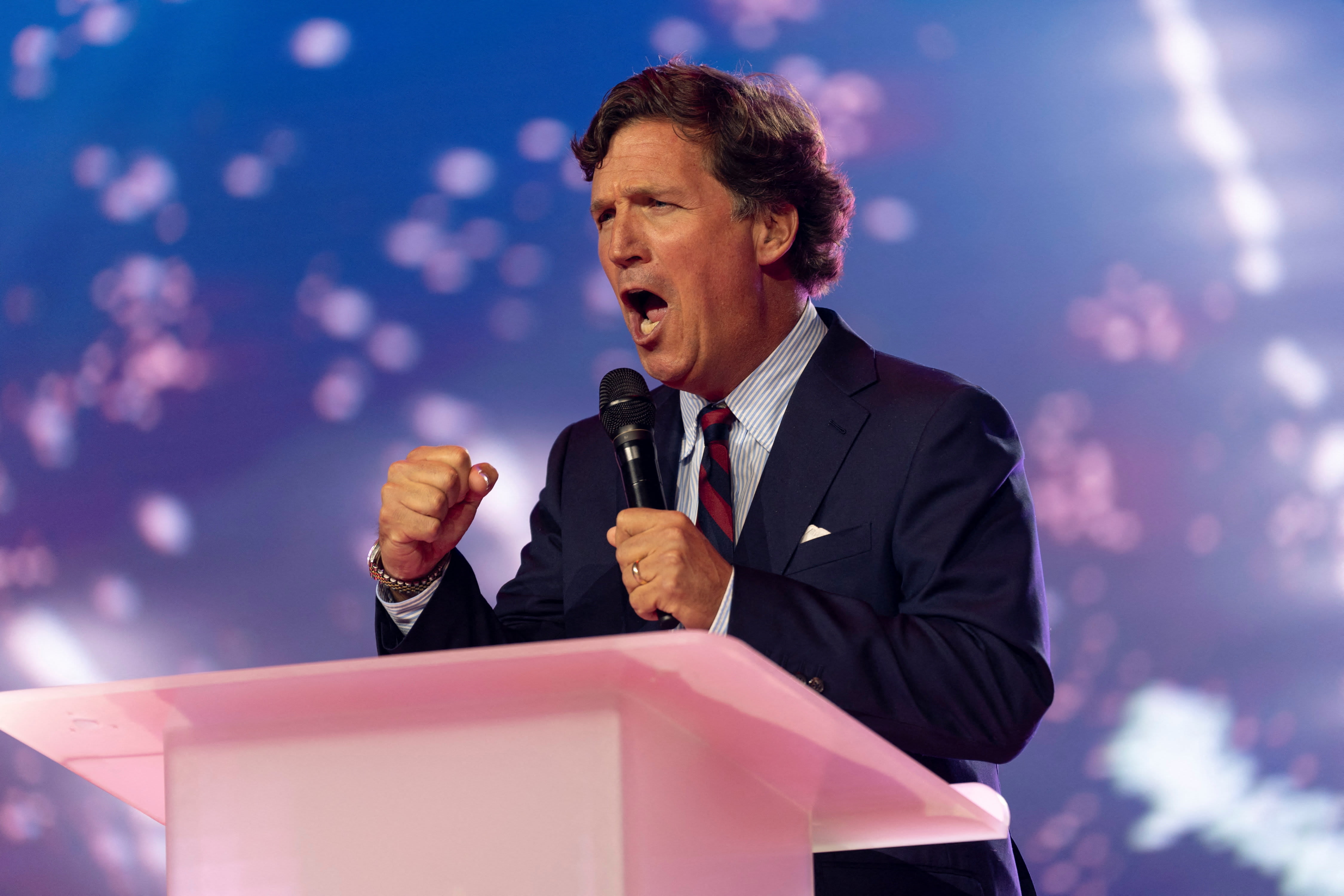 Tucker Carlson speaks during AmericaFest, the first Turning Point USA summit since the death of Charlie Kirk, in Phoenix, Arizona, US December 18, 2025.  (photo credit: REUTERS/Cheney Orr)