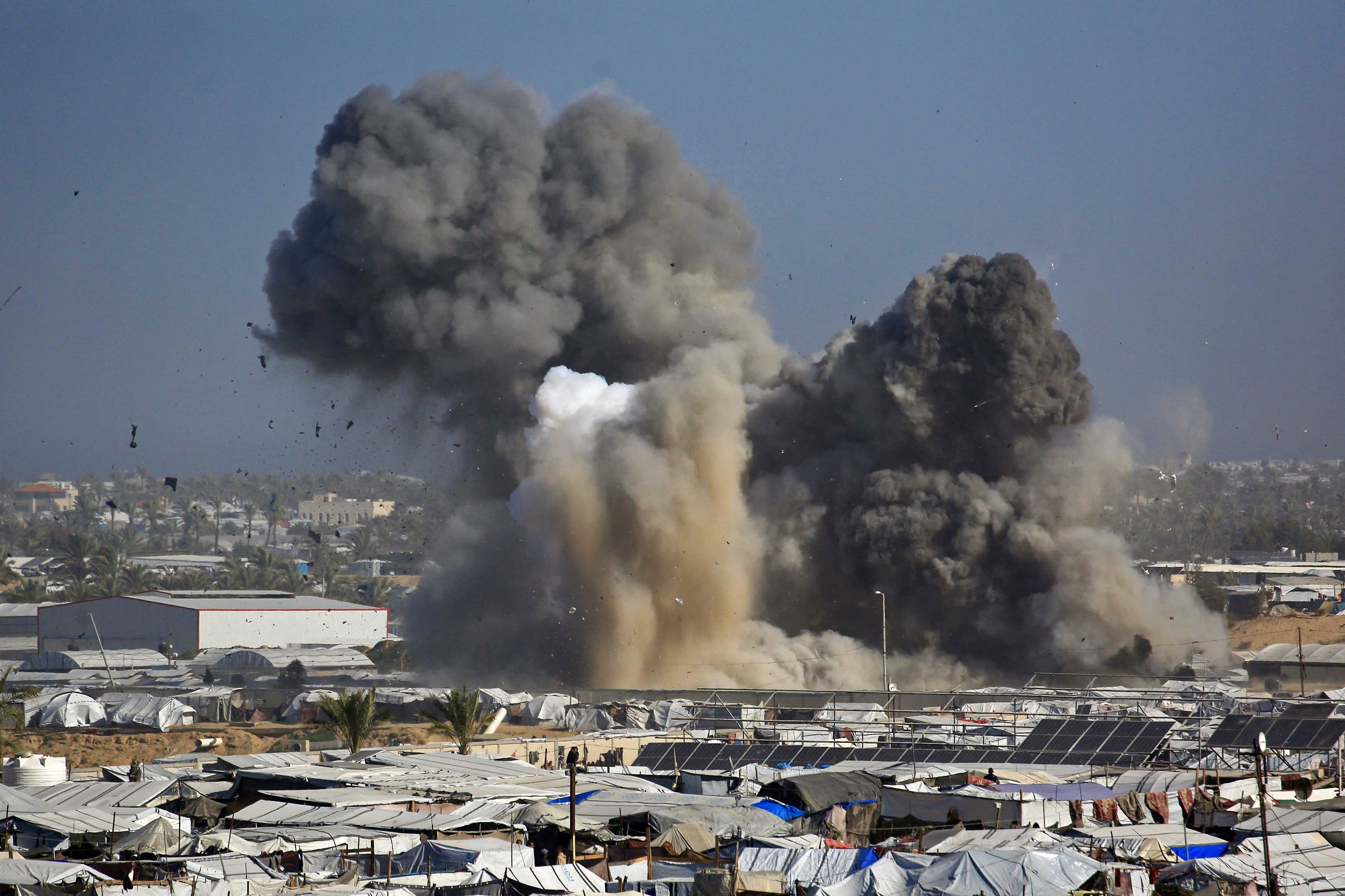 Smoke rises from the Gath shelter, housing displaced Palestinians, after an Israeli air strike in the west of Khan Yunis, southern Gaza Strip on January 31, 2026. (photo credit: Bashar Taleb / AFP via Getty Images)