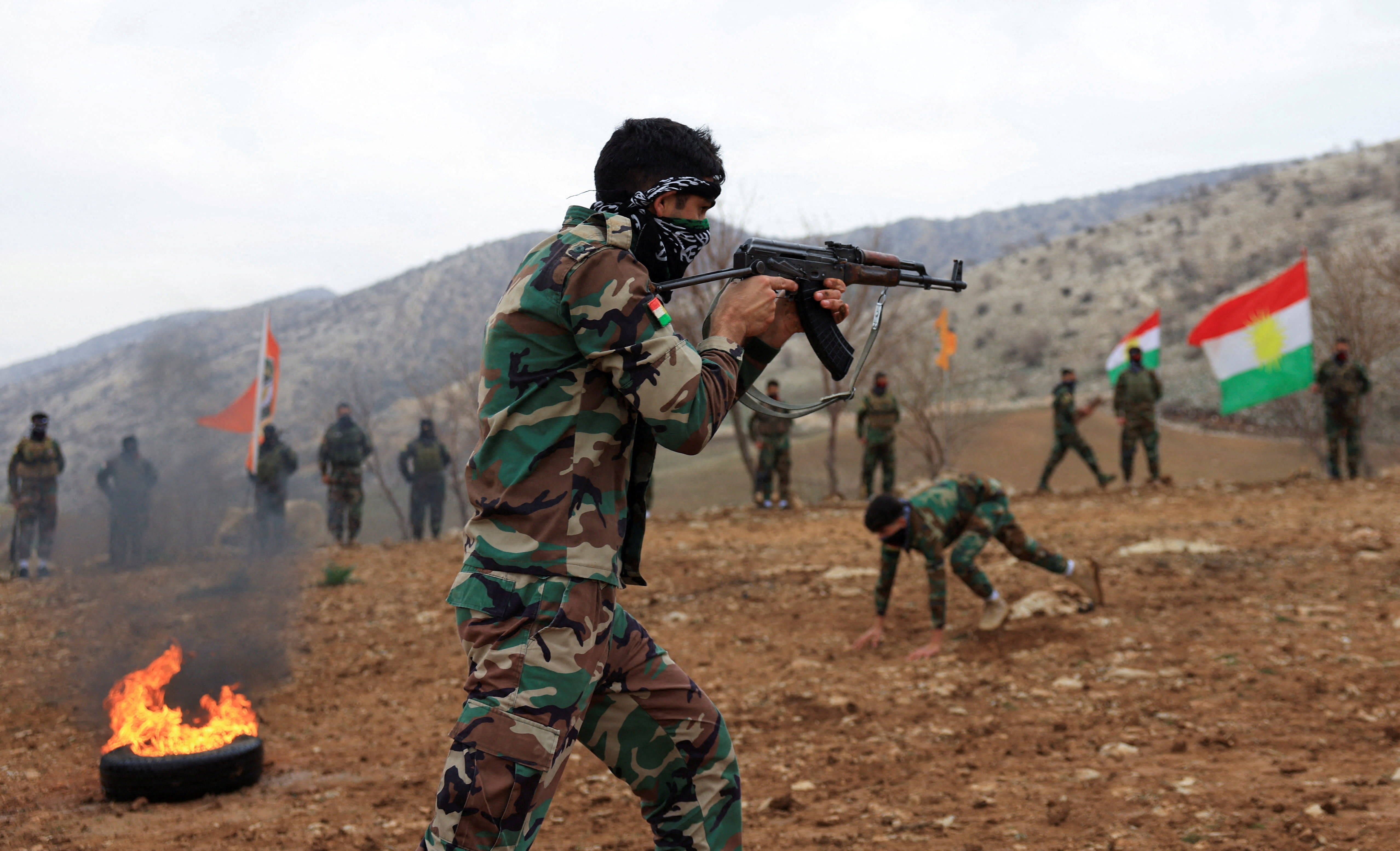 A fighter from the Iranian Kurdistan Freedom Party (PAK) takes part in a training exercise at a base near Erbil, Iraq, in February. (photo credit: THAIER AL-SUDANI/REUTERS)