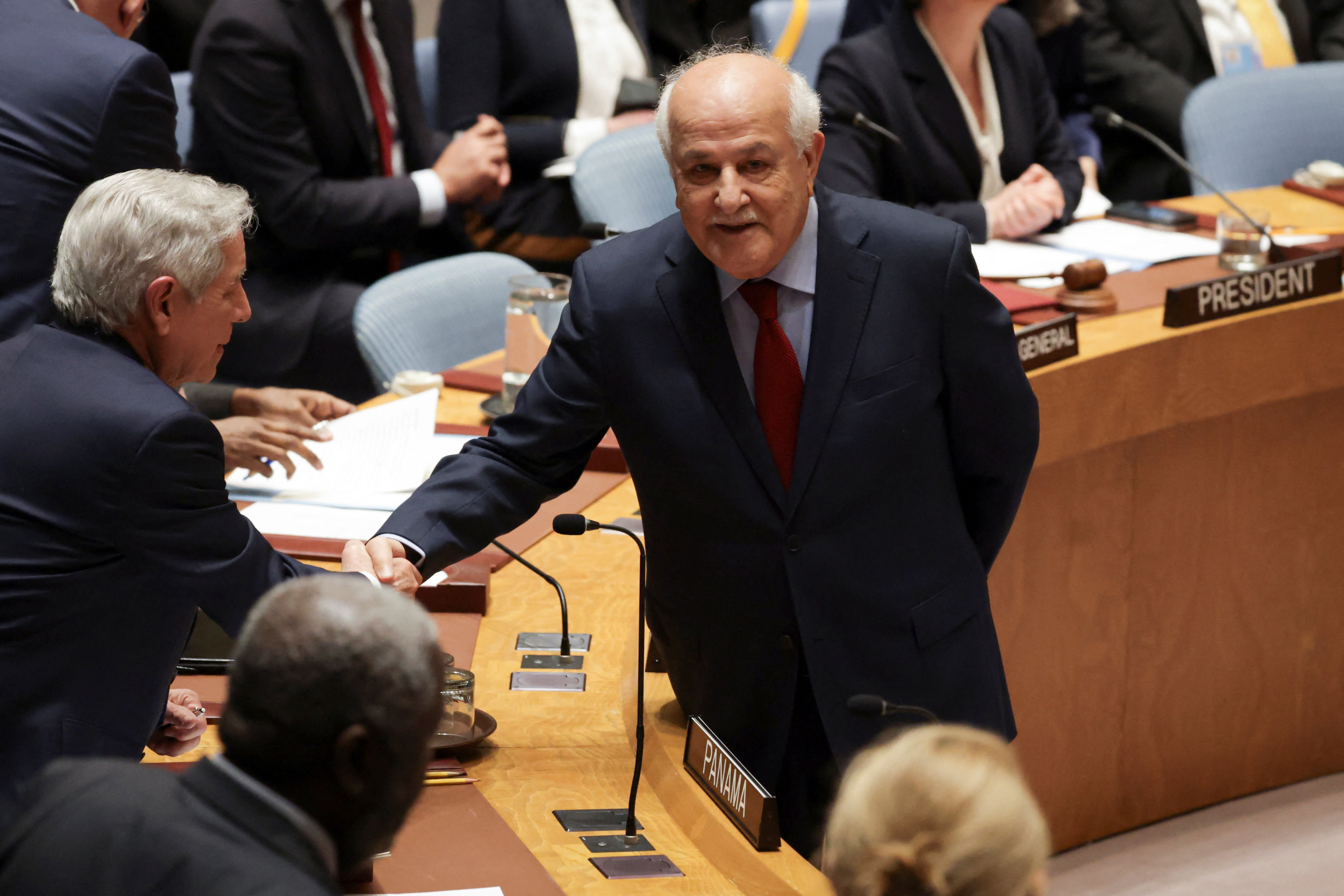RIYAD H. MANSOUR, Palestinian Permanent Observer to the United Nations, shakes hands with Eloy Alfaro de Alba, Permanent Representative of Panama to the UN, before a Security Council meeting on the situation in the Middle East, at UN headquarters in New York City, US, February 18, 2026. (photo credit: REUTERS/JEENAH MOON) RIYAD H. MANSOUR, Palestinian Permanent Observer to the United Nations, shakes hands with Eloy Alfaro de Alba, Permanent Representative of Panama to the UN, before a Security Council meeting on the situation in the Middle East, at UN headquarters in New York City, US, February 18, 2026. (photo credit: REUTERS/JEENAH MOON)