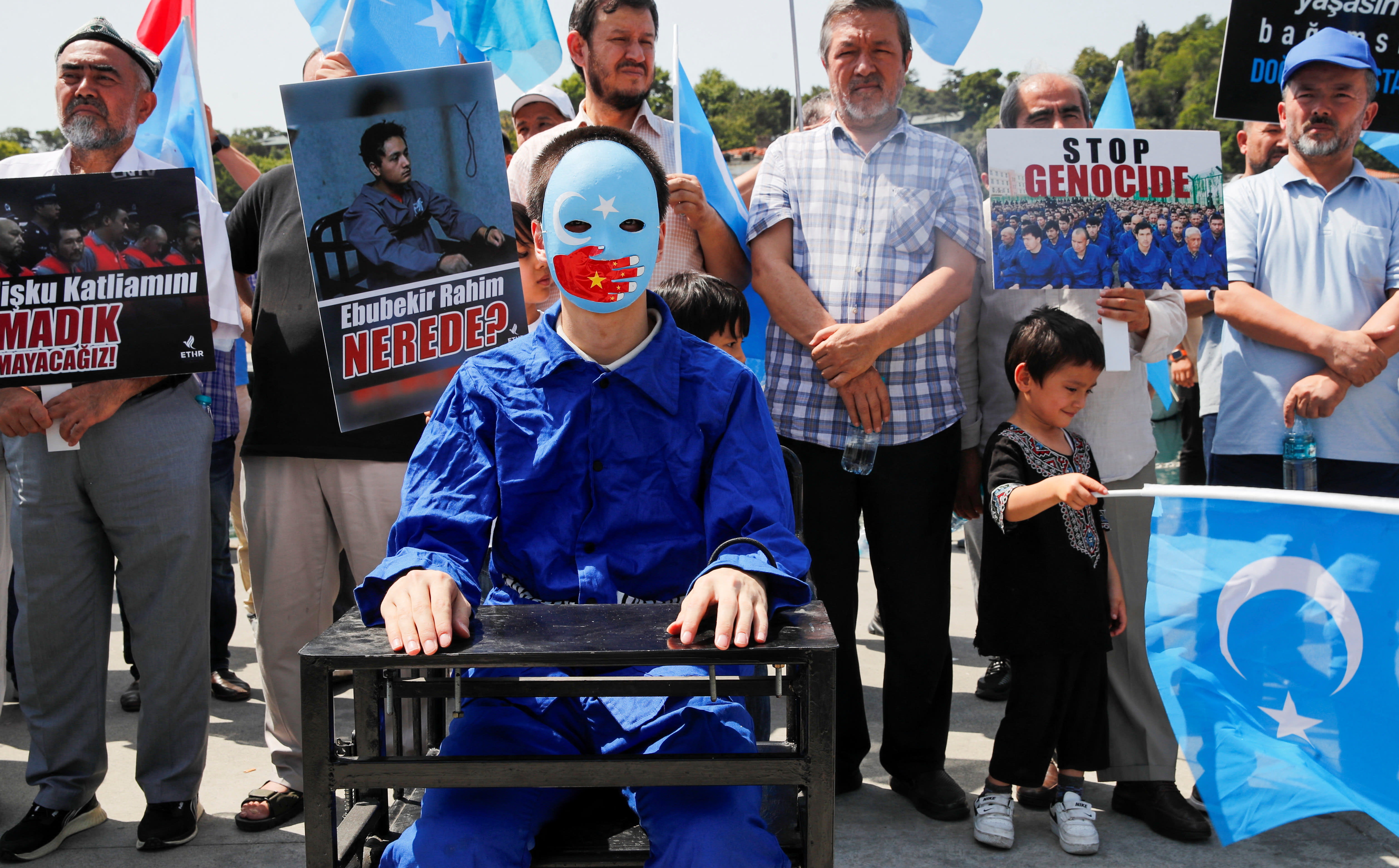 Ethnic Uyghur demonstrators take part in a protest against the visit of Chinese Foreign Minister Wang Yi to the Turkish capital, near the Chinese consulate in Istanbul, Turkey July 26, 2023. (photo credit: DILARA SENKAYA/REUTERS)