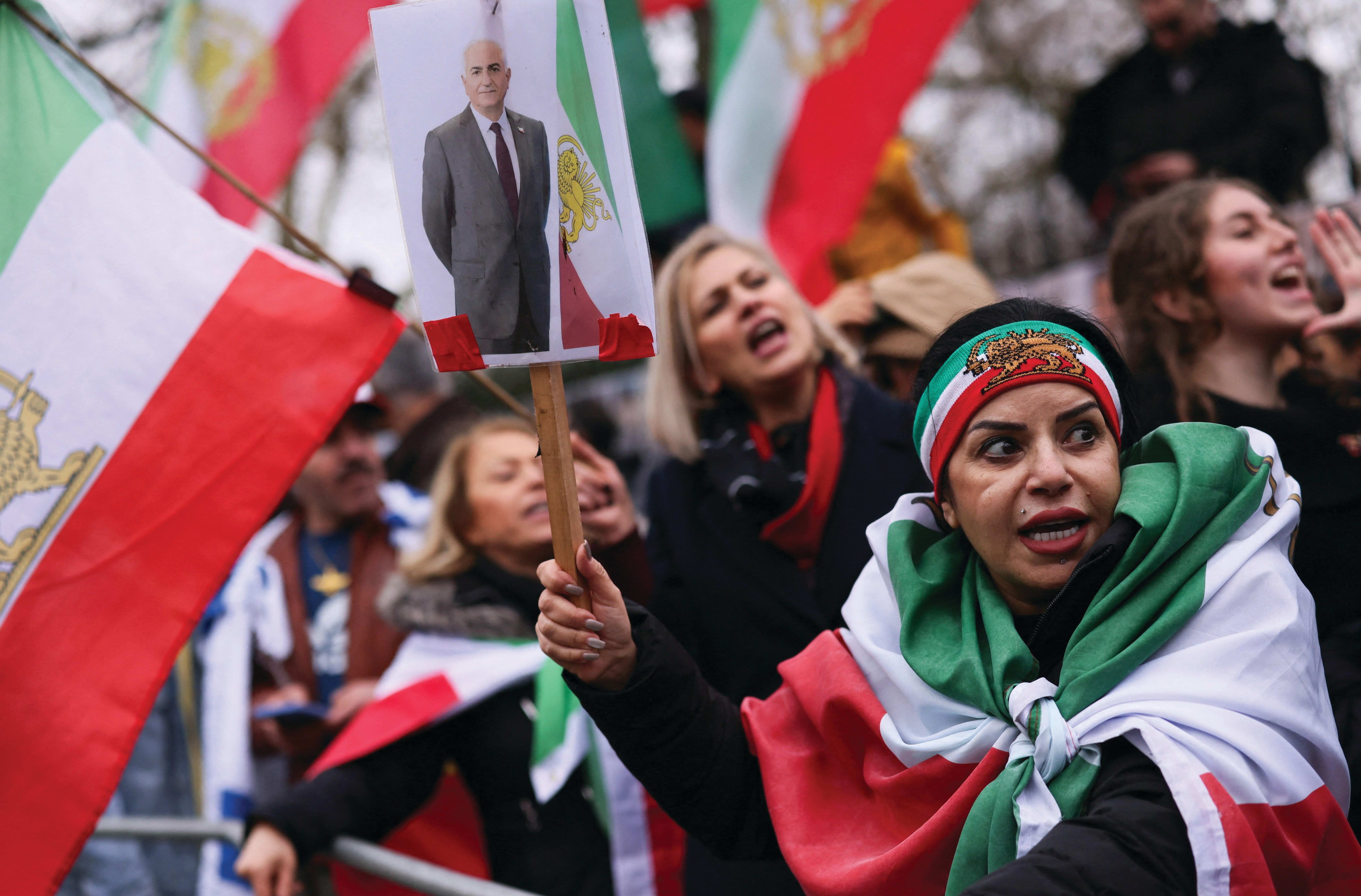 A WOMAN holds a placard with a picture of Reza Pahlavi as people gather outside the Iranian Embassy in London after Iran’s Supreme Leader Ayatollah Ali Khamenei was killed. (photo credit: Jack Taylor/Reuters) A WOMAN holds a placard with a picture of Reza Pahlavi as people gather outside the Iranian Embassy in London after Iran’s Supreme Leader Ayatollah Ali Khamenei was killed. (photo credit: Jack Taylor/Reuters)