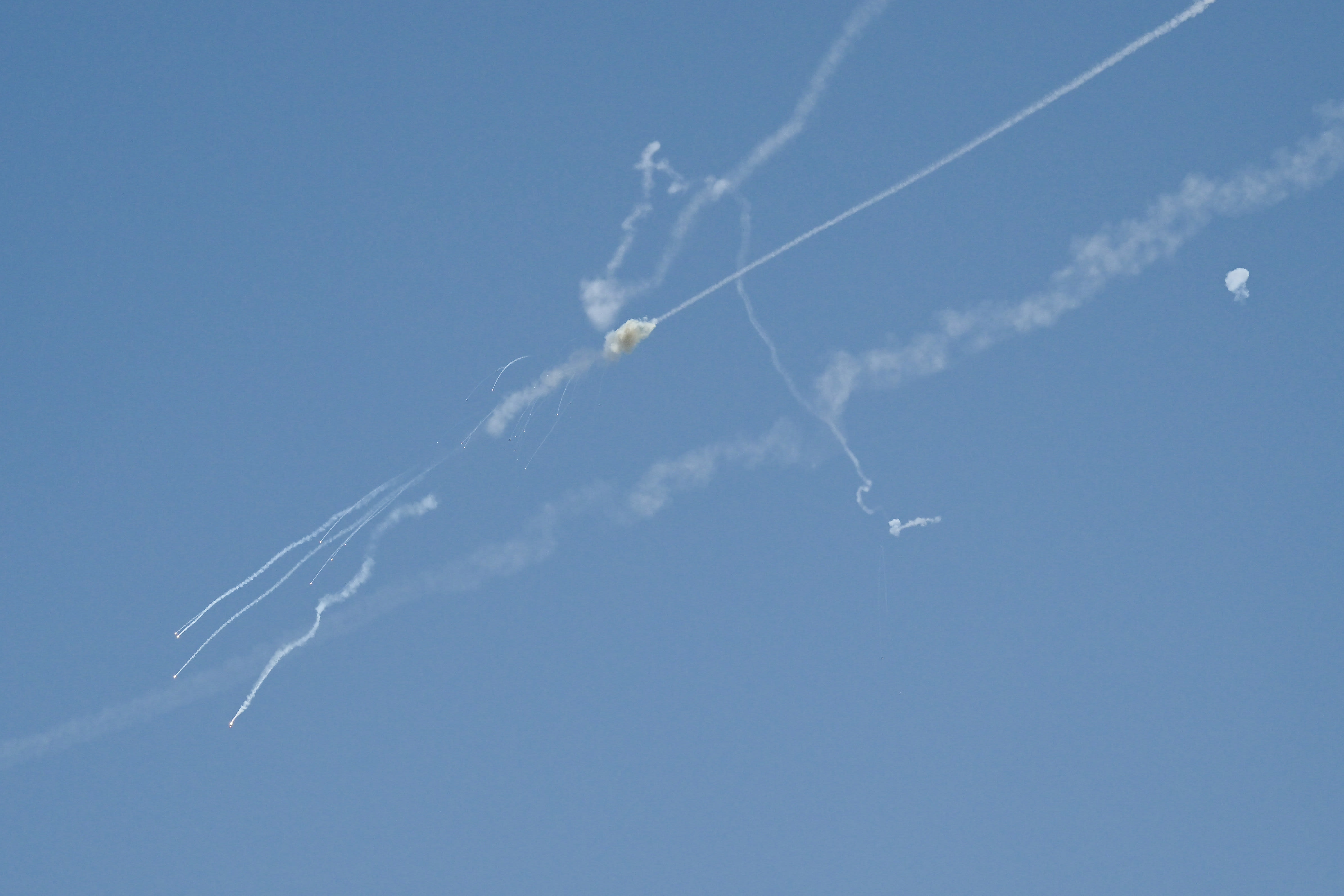 Explosions from the interception of an Iranian projectile are seen in the sky over Dubai on March 1, 2026. (photo credit: Giuseppe CACACE / AFP via Getty Images)