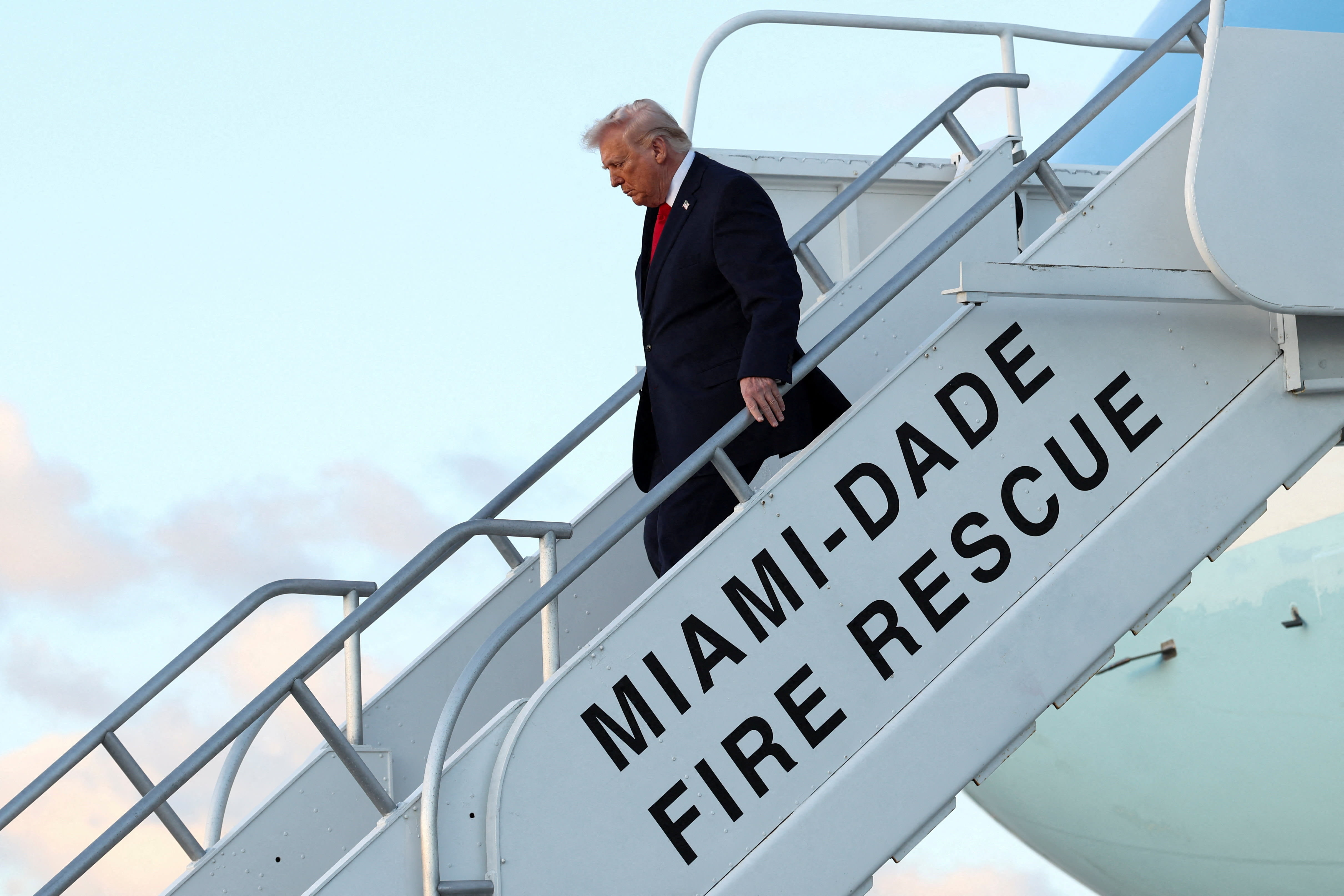 US President Donald Trump exits Air Force One as he arrives at Miami International Airport in Florida, US, April 11, 2026.  (photo credit: REUTERS/KEVIN LAMARQUE)