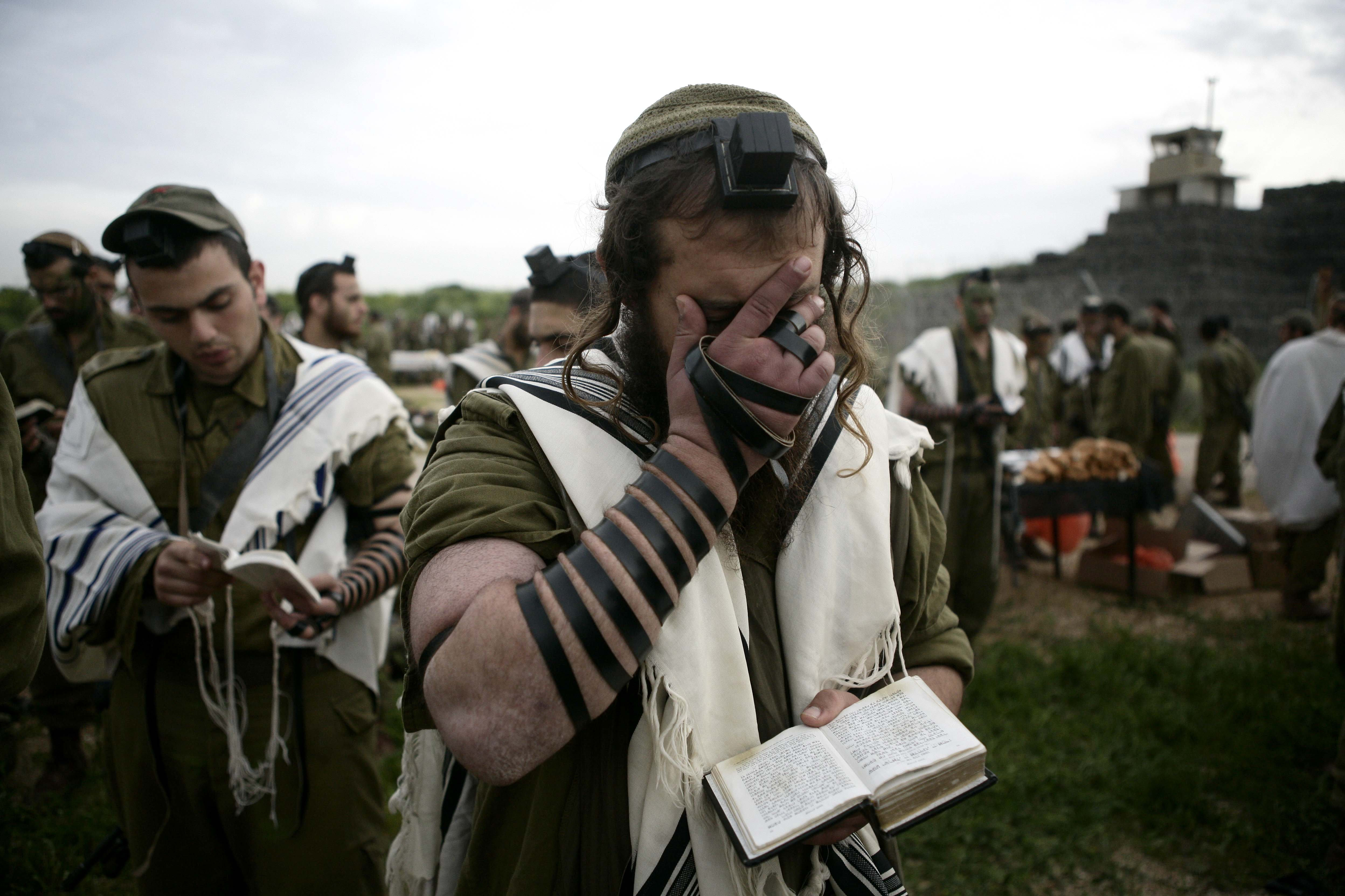 Soldiers of the Neztah Yehuda Battalion complete the final stages of a 40 kilometer journey all throught the night of Feb 16 2010. (photo credit: ABIR SULTAN/FLASH90)