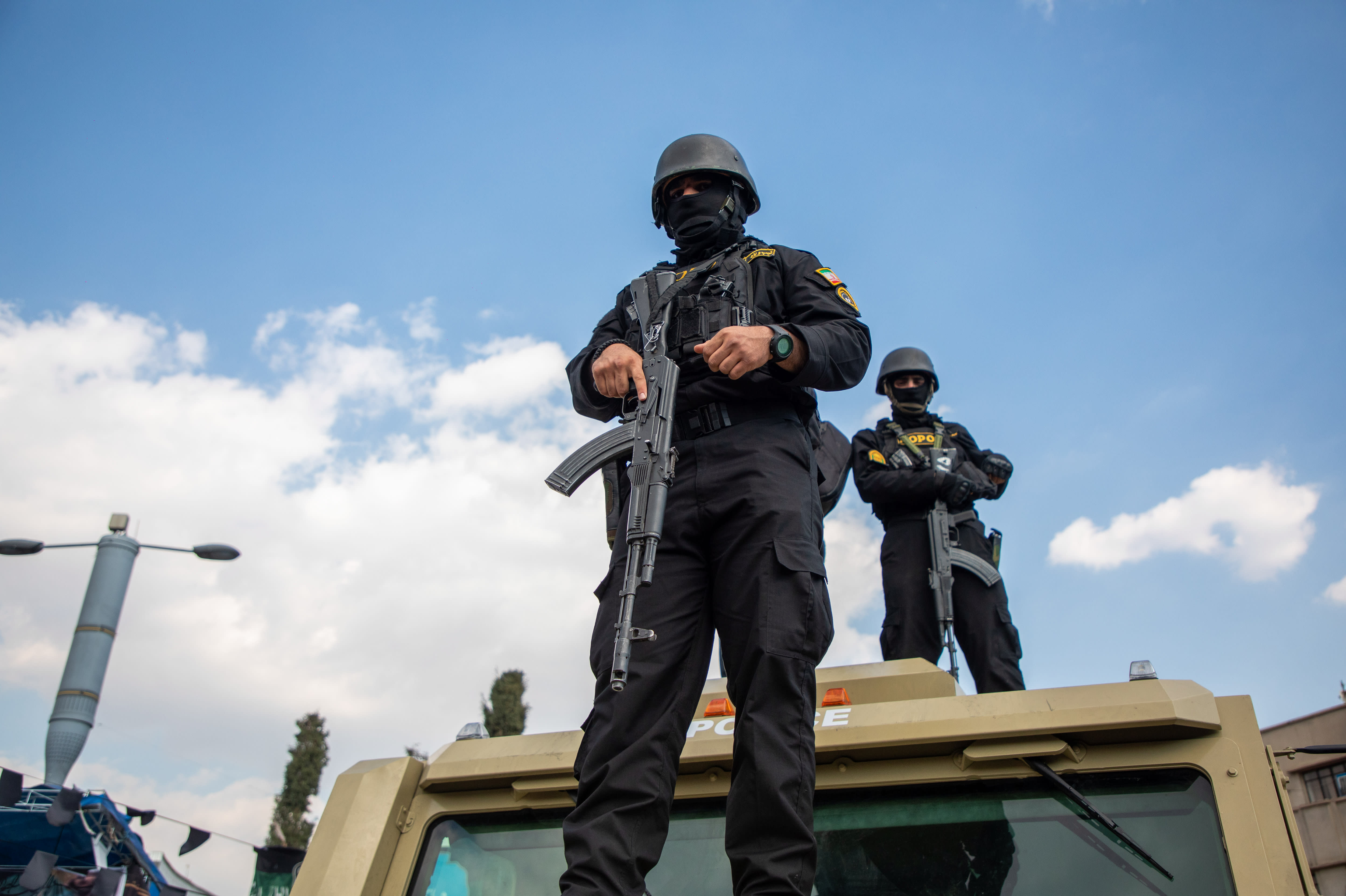 Members of security forces look on during a funeral procession held for IRGC Navy Chief Alireza Tangsiri, alongside other senior naval commanders and their families who were killed in US-Israeli strikes in late March, on April 1, 2026 in Tehran, Iran. (photo credit: Majid Saeedi/Getty Images)