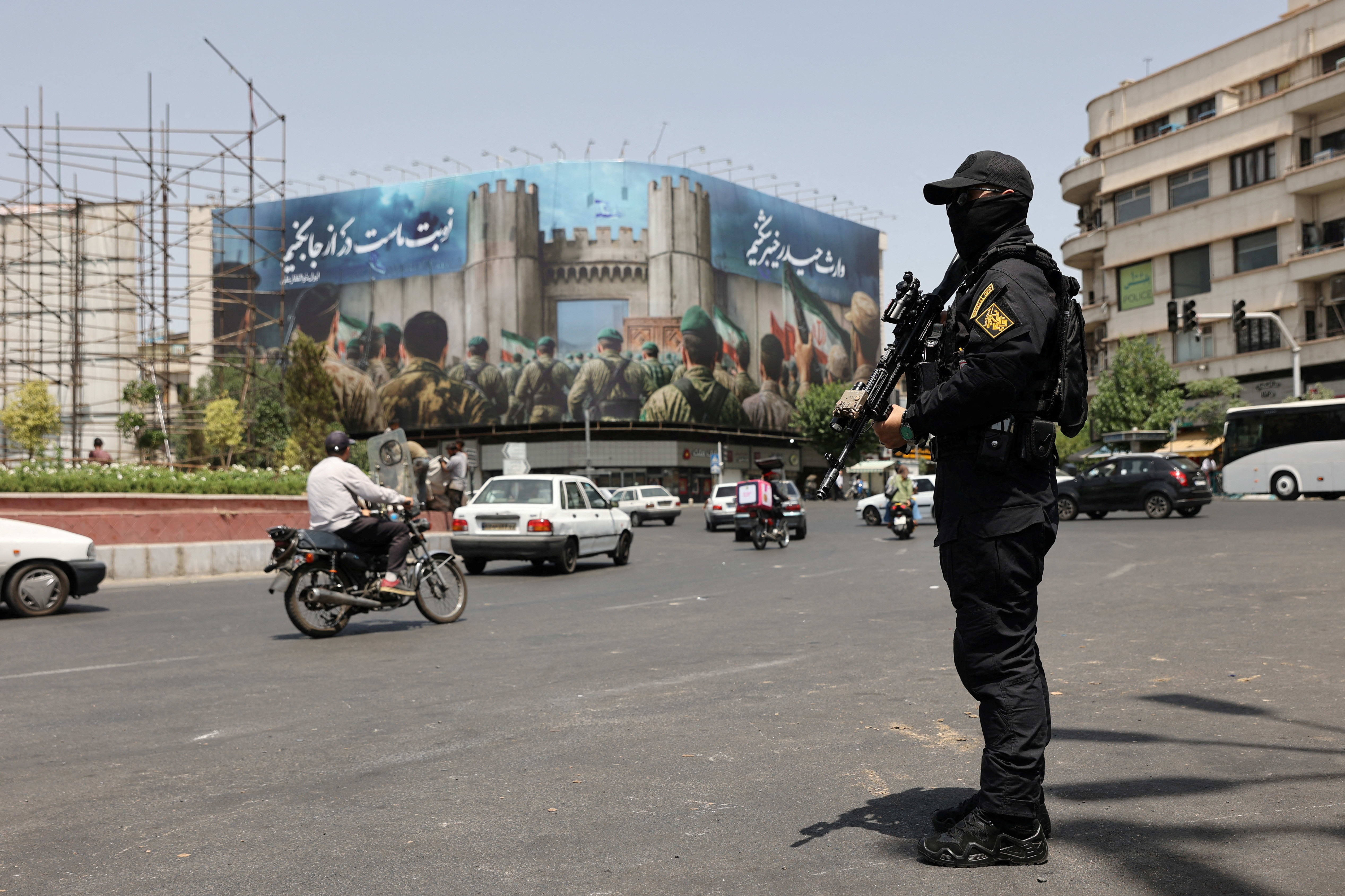  A security guard stands on a street, during early hours of ceasefire, in Tehran, Iran, June 24, 2025.  (photo credit: MAJID ASGARIPOUR/WANA (WEST ASIA NEWS AGENCY) VIA REUTERS)