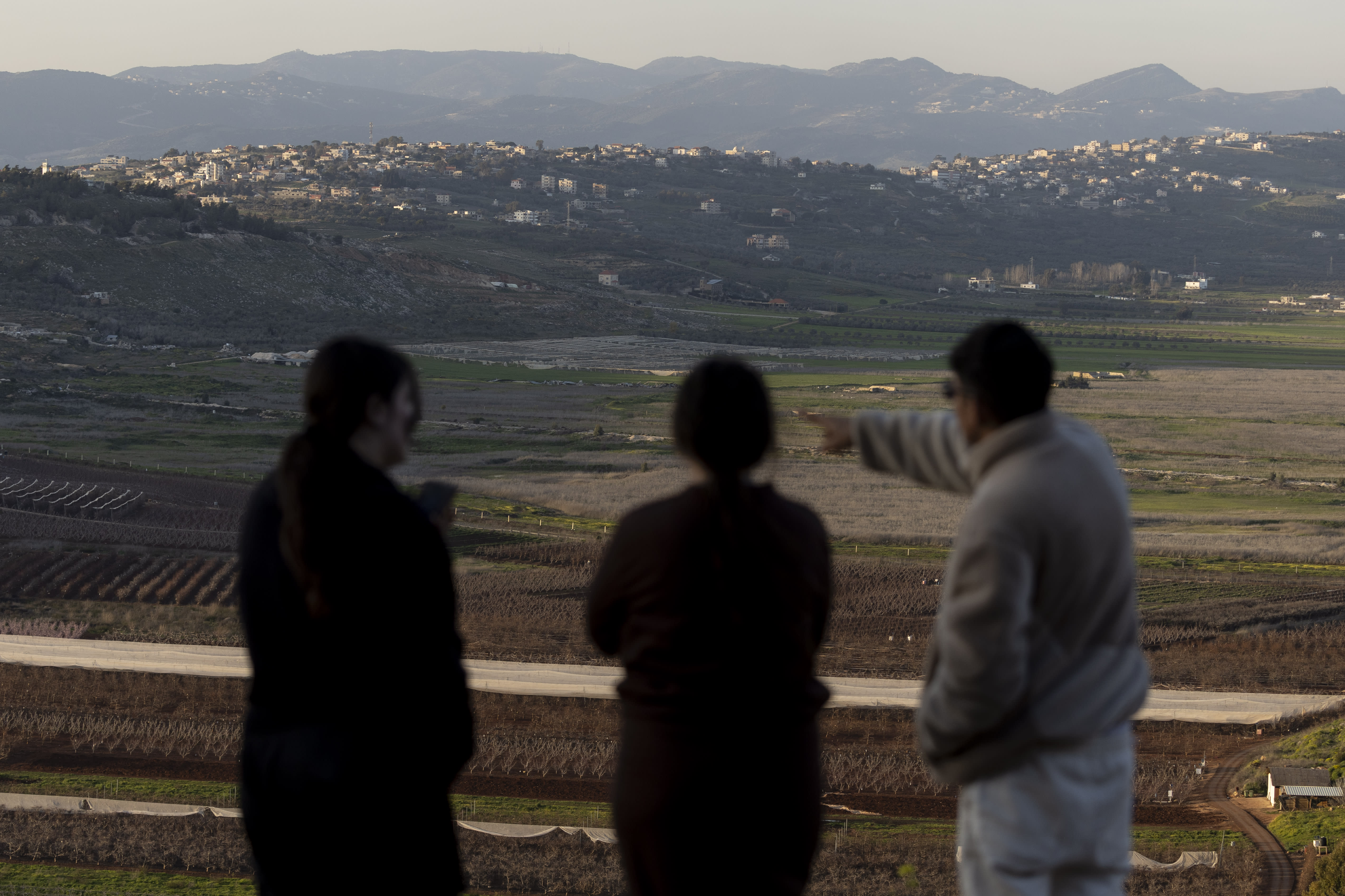 Israelis look at the border with Lebanon from a position in the northern village of Metula, near the border with Lebanon on March 5, 2026.  (photo credit: Amir Levy/Getty Images)