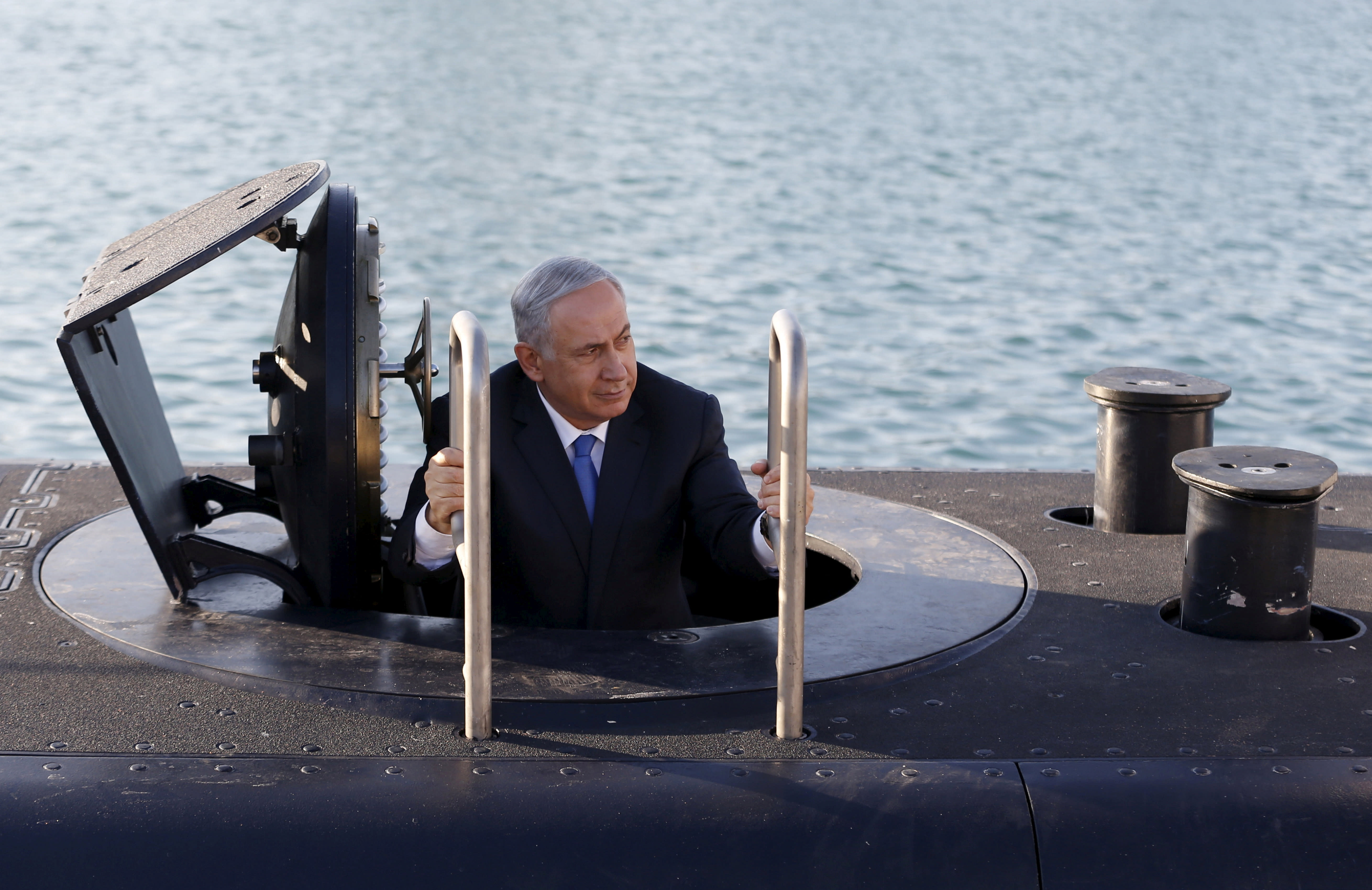 Prime Minister Benjamin Netanyahu climbs out of the 