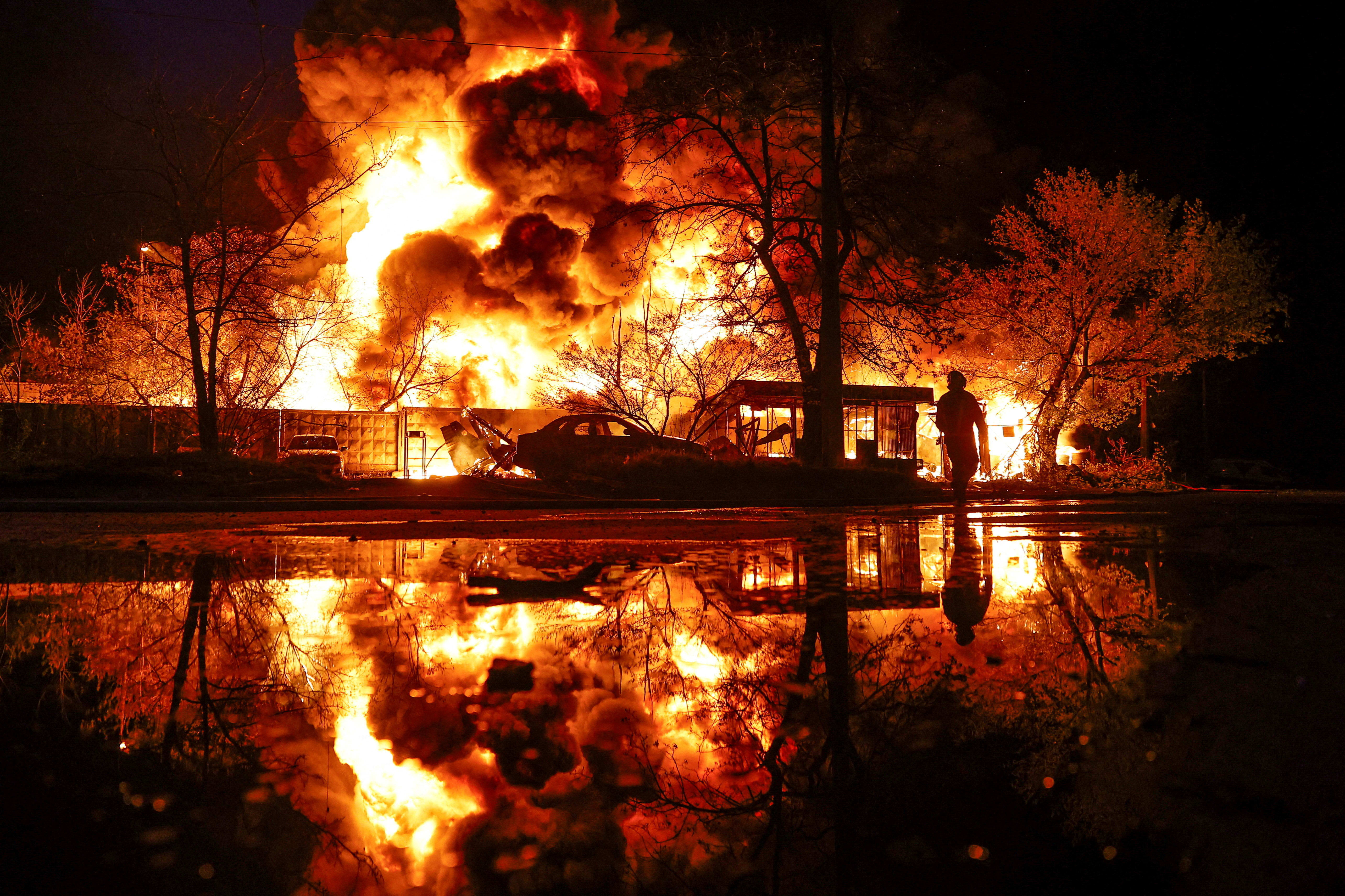 A firefighter works at the site of a recyclable materials warehouse hit by a Russian missile strike, amid Russia