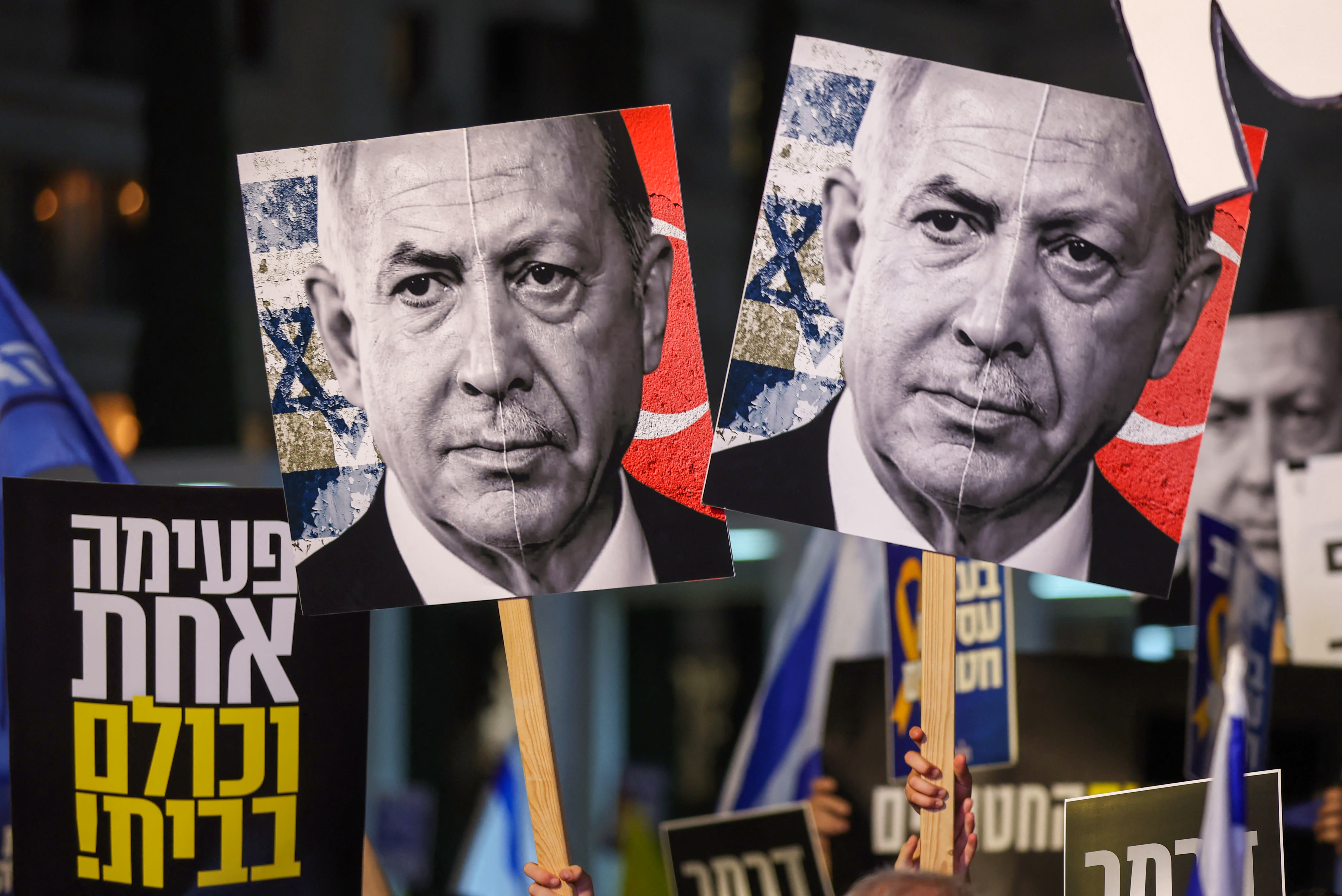 Demonstrators hold placards with portraits of Israeli Prime Minister Benjamin Netanyahu (L) and Turkish President Recep Tayyip Erdogan (R) during a protest. (photo credit: JACK GUEZ/AFP VIA GETTY IMAGES)