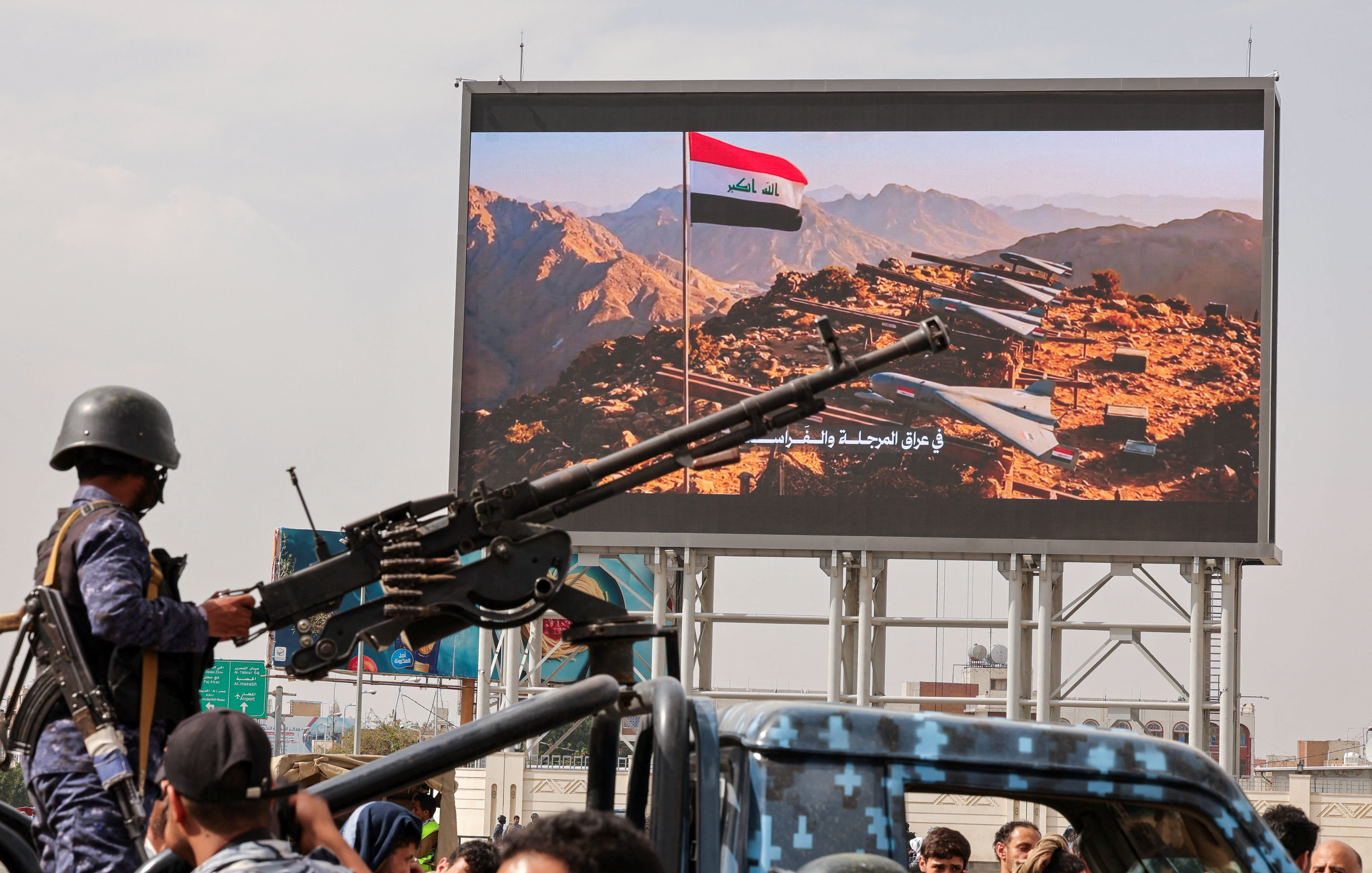A member of Houthi security forces mans a machine gun mounted on the back of a patrol vehicle at the site of an anti-Saudi rally amid an escalation with the kingdom in Sanaa, Yemen, last month.  (photo credit: KHALED ABDULLAH/REUTERS)