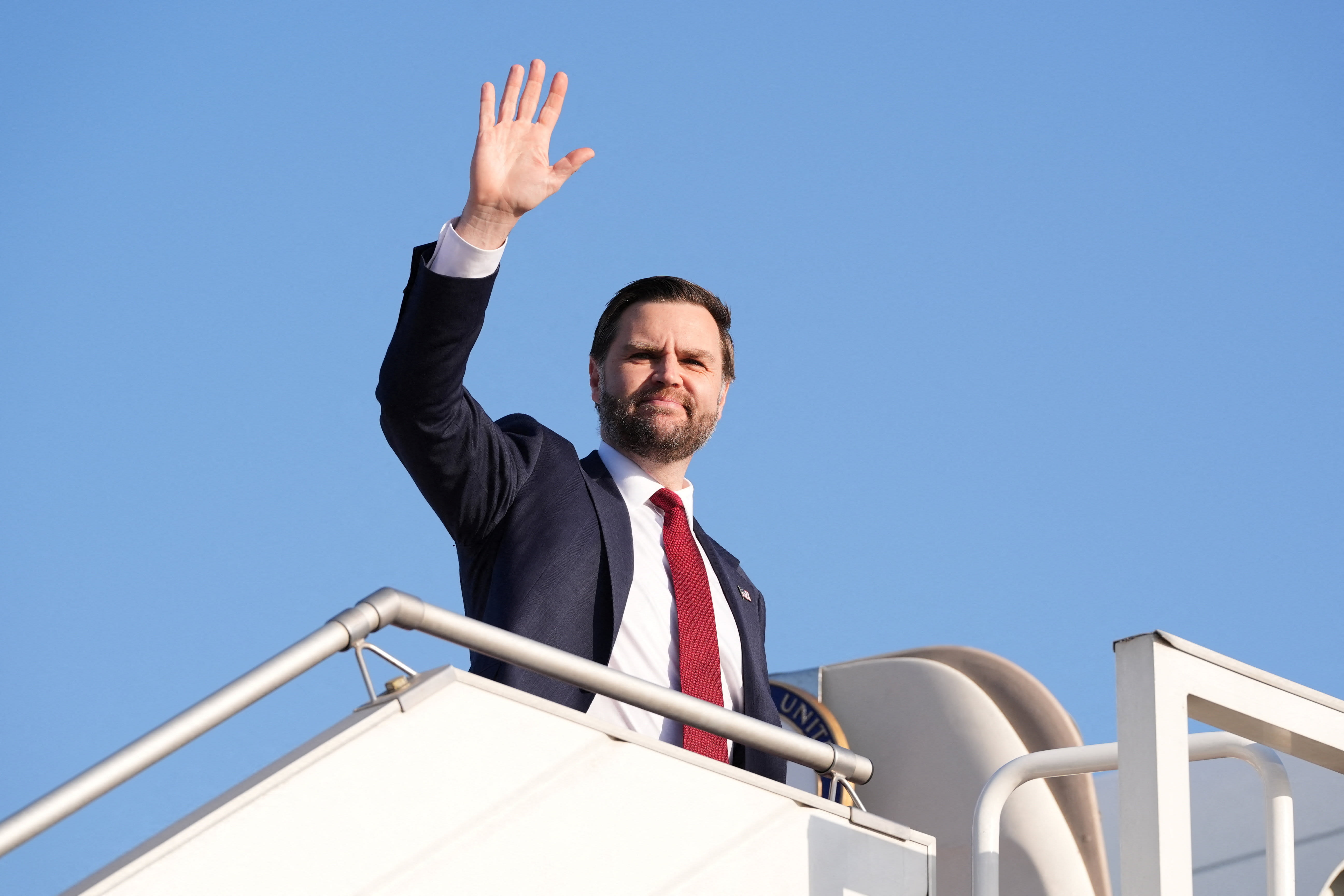 US Vice President JD Vance waves as he boards Air Force Two, after peace talks with Iran in Islamabad, Pakistan, Sunday, April 12, 2026. (photo credit: Jacquelyn Martin/Pool via REUTERS)