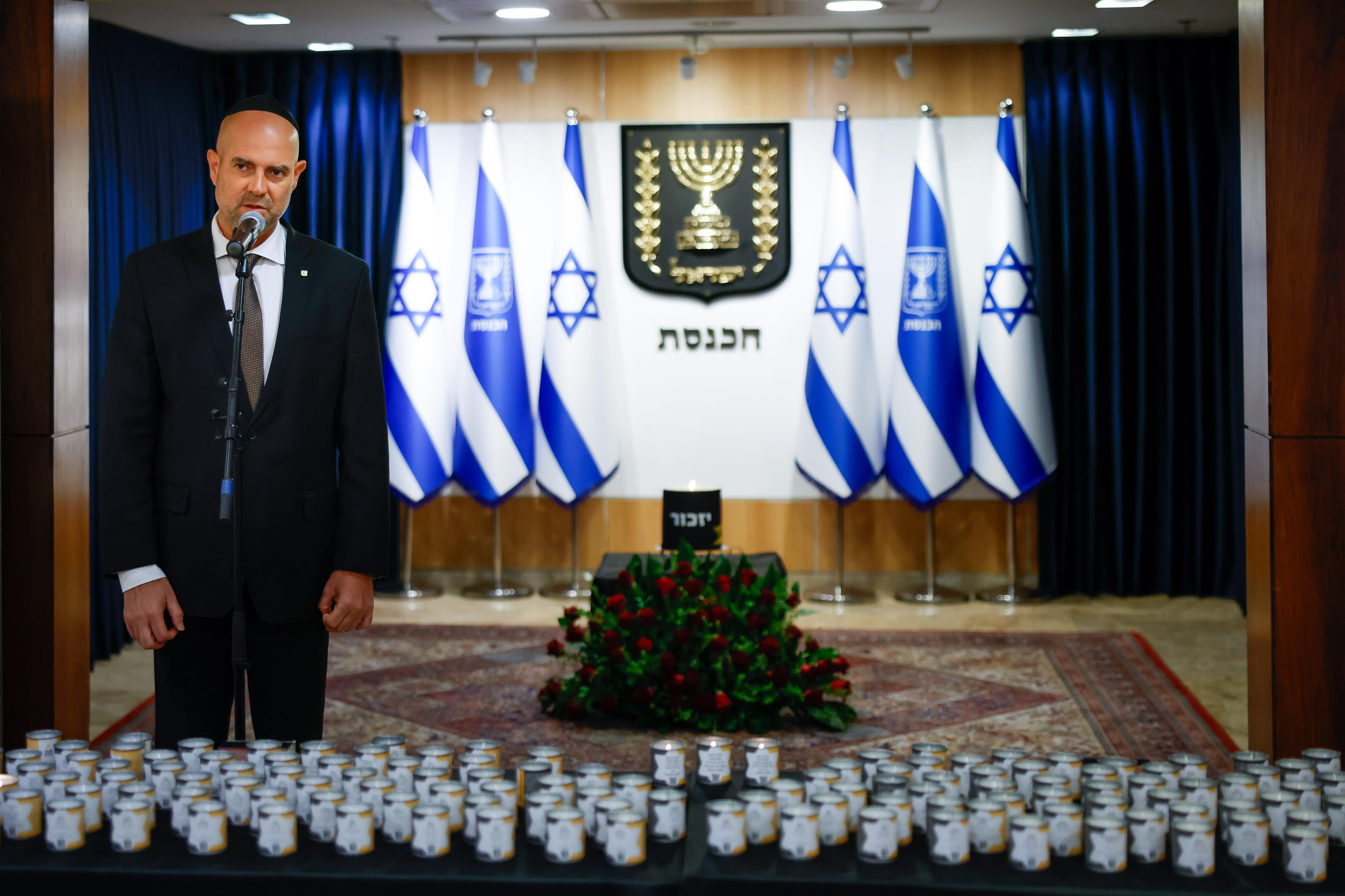 Knesset Speaker Amir Ohana lights memorial candles on Holocaust Remembrance Day at the Knesset entrance, Tuesday April, 14, 2026. (photo credit: NOAM MOSKOVITZ/KNESSET)