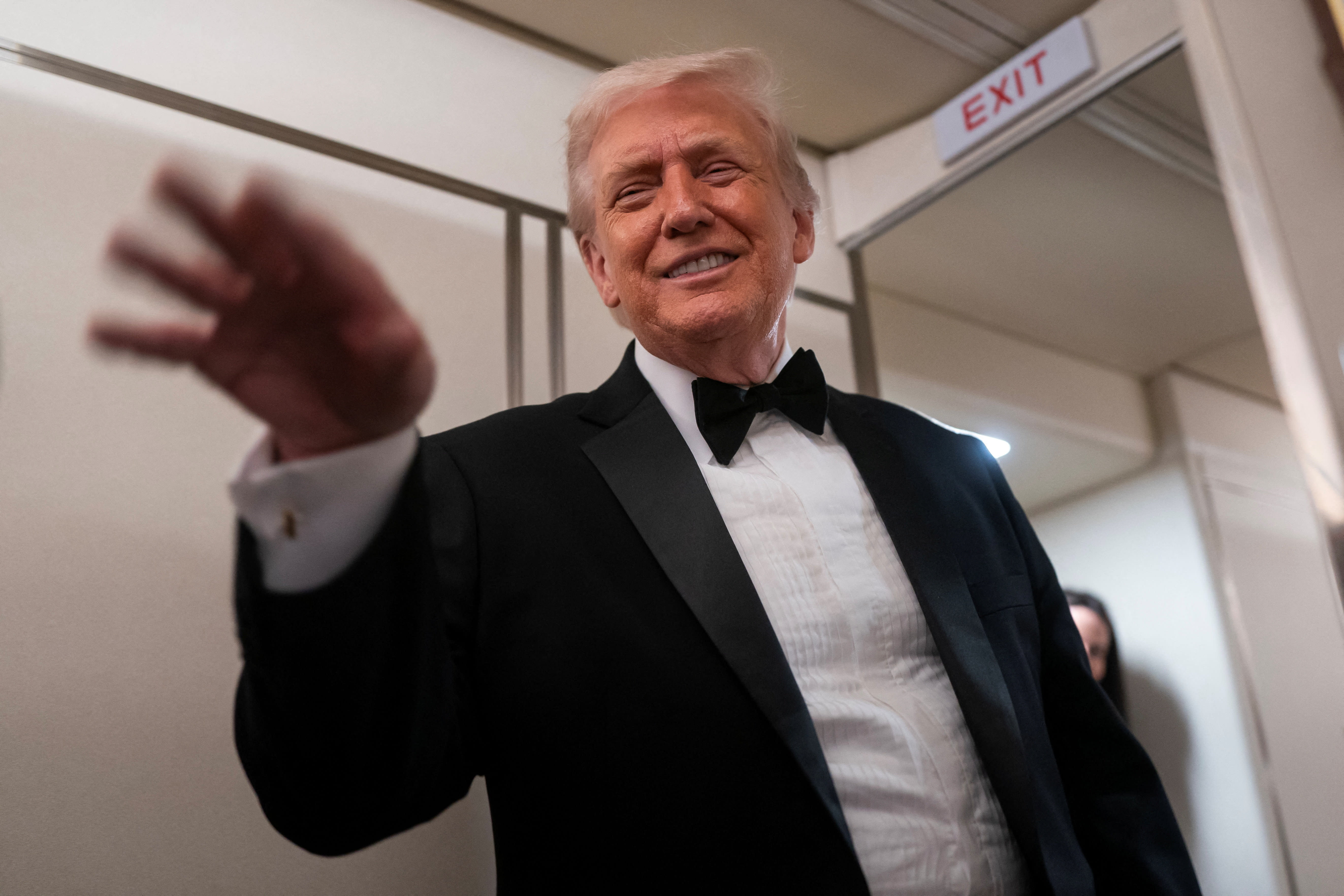 US President Donald Trump waves after speaking with members of the media on board Air Force One en route to Palm Beach, Florida, US, January 31, 2026. (photo credit: Nathan Howard/Reuters)