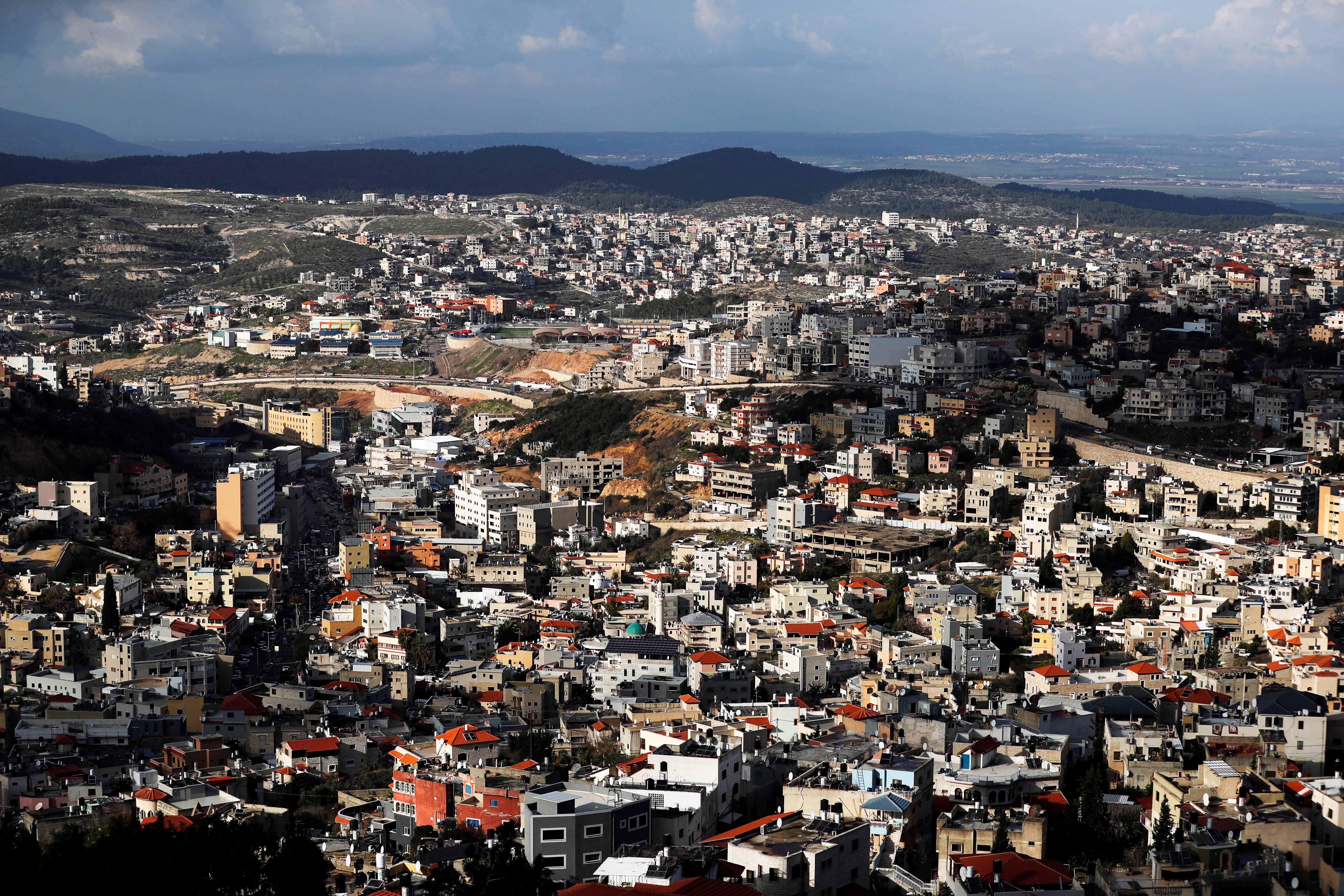 THE ARAB-ISRAELI city of Umm al-Fahm in the foreground and Wadi Ara in the background.  (photo credit: REUTERS)