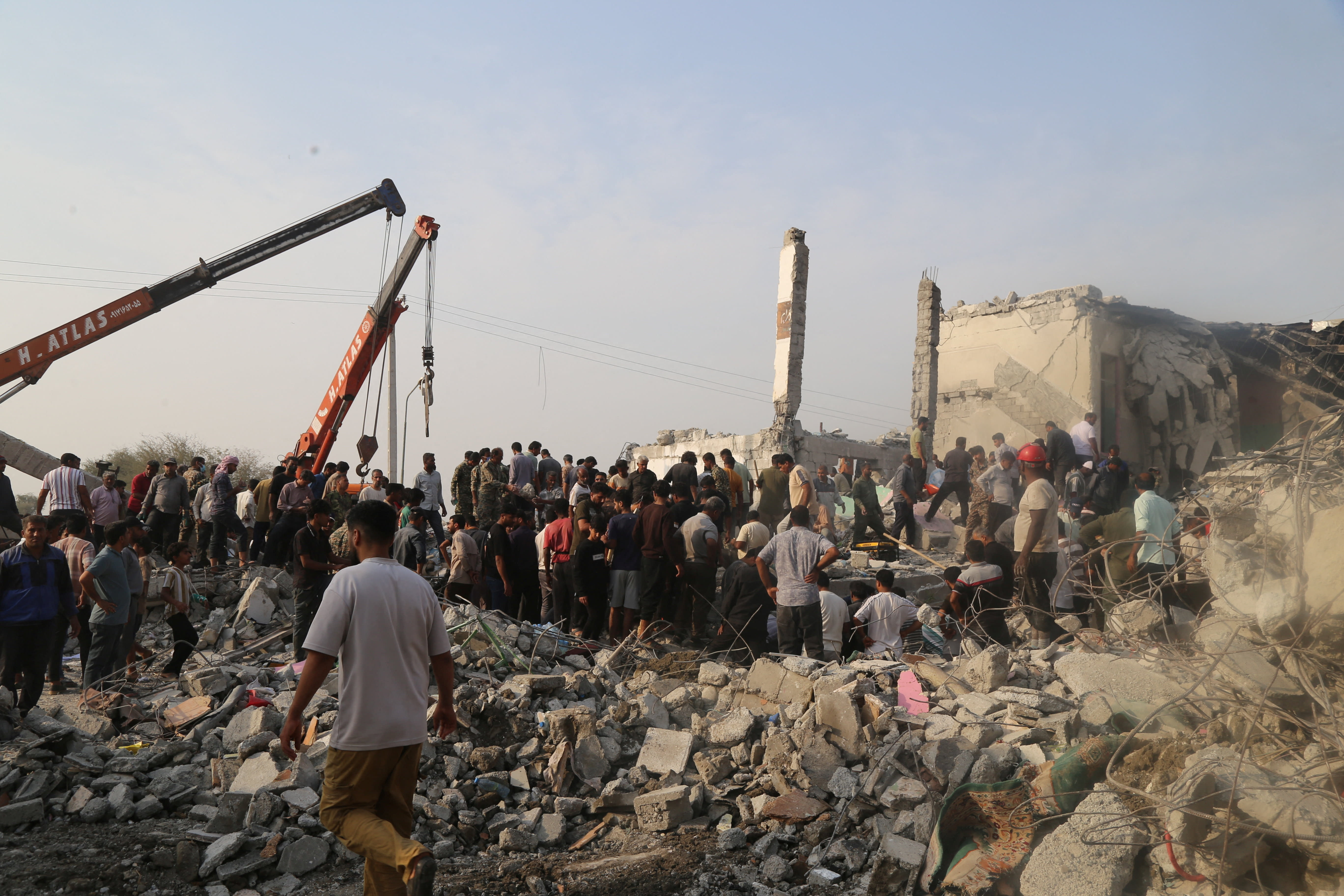 People and rescue forces work following an Israel strike on a school in Minab, Iran, February 28, 2026.  (photo credit: Abbas Zakeri/Mehr News/WANA (West Asia News Agency) via REUTERS)