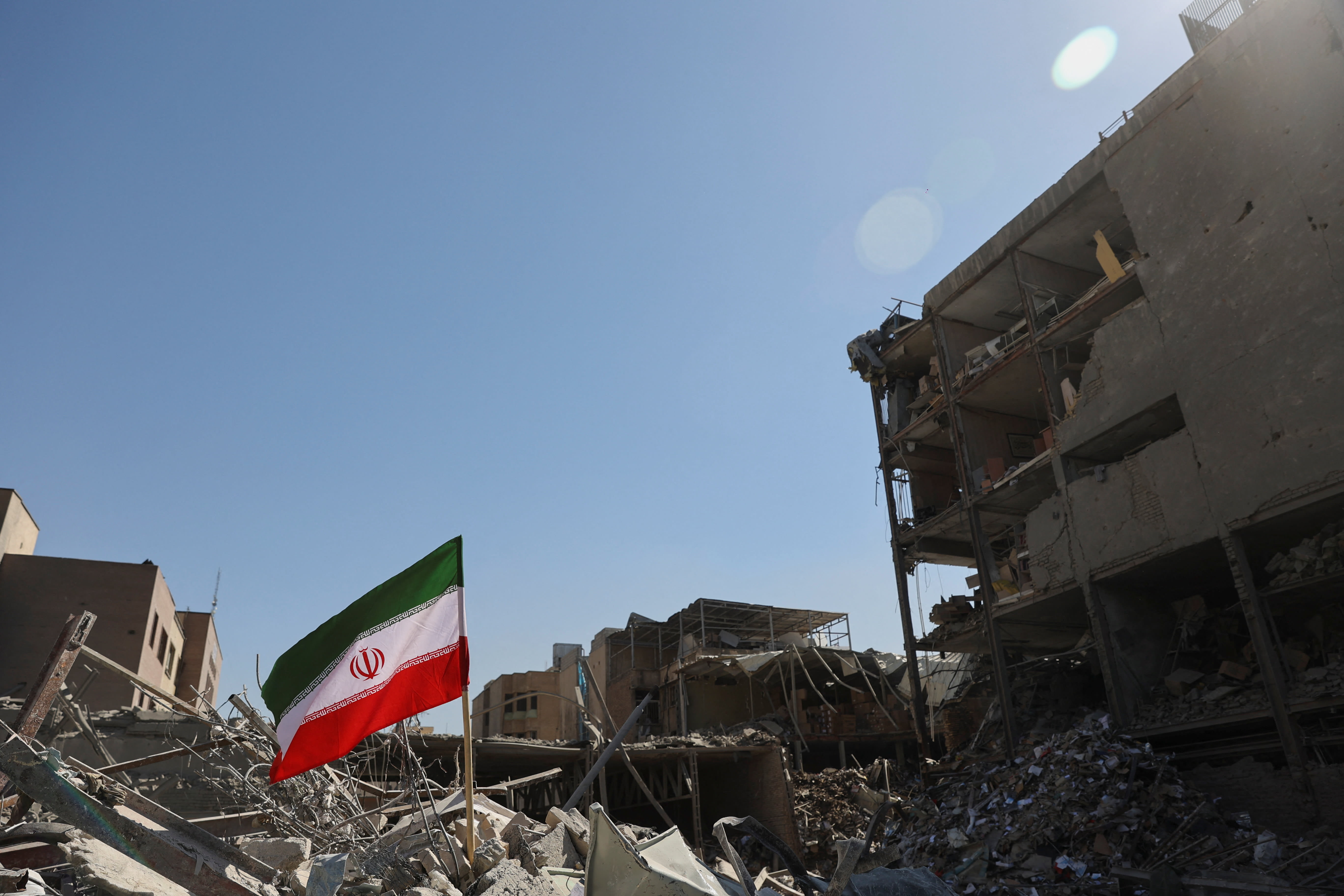 The national flag of Iran flies in the wind as debris lies scattered in the aftermath of an Israeli and U.S. strike on a police station, amid the US-Israeli conflict with Iran, in Tehran, Iran, March 3, 2026. (photo credit: MAJID ASGARIPOUR/WANA (WEST ASIA NEWS AGENCY) VIA REUTERS) The national flag of Iran flies in the wind as debris lies scattered in the aftermath of an Israeli and U.S. strike on a police station, amid the US-Israeli conflict with Iran, in Tehran, Iran, March 3, 2026. (photo credit: MAJID ASGARIPOUR/WANA (WEST ASIA NEWS AGENCY) VIA REUTERS)