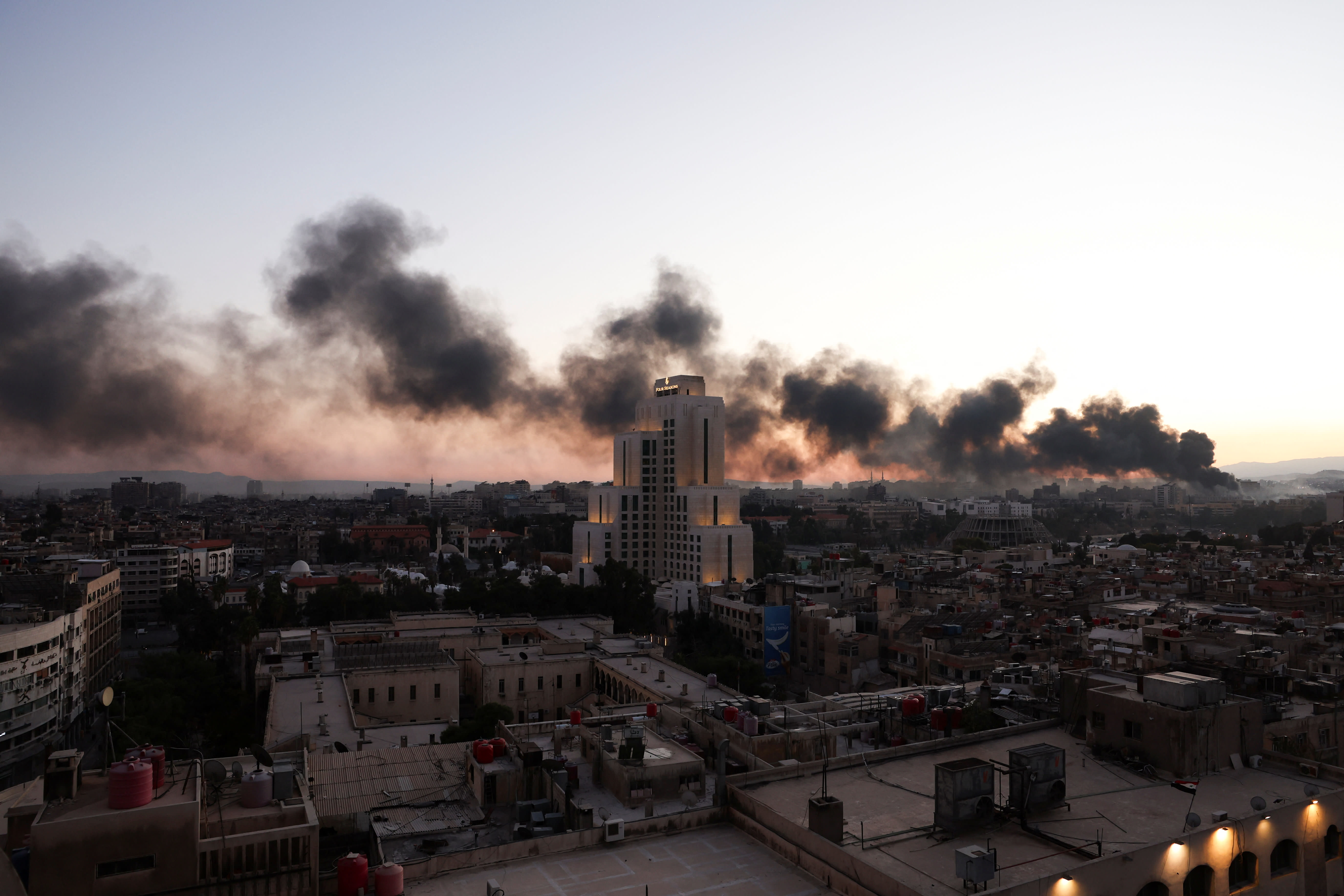  Smoke rises, after Syrian rebels announced that they have ousted Syria