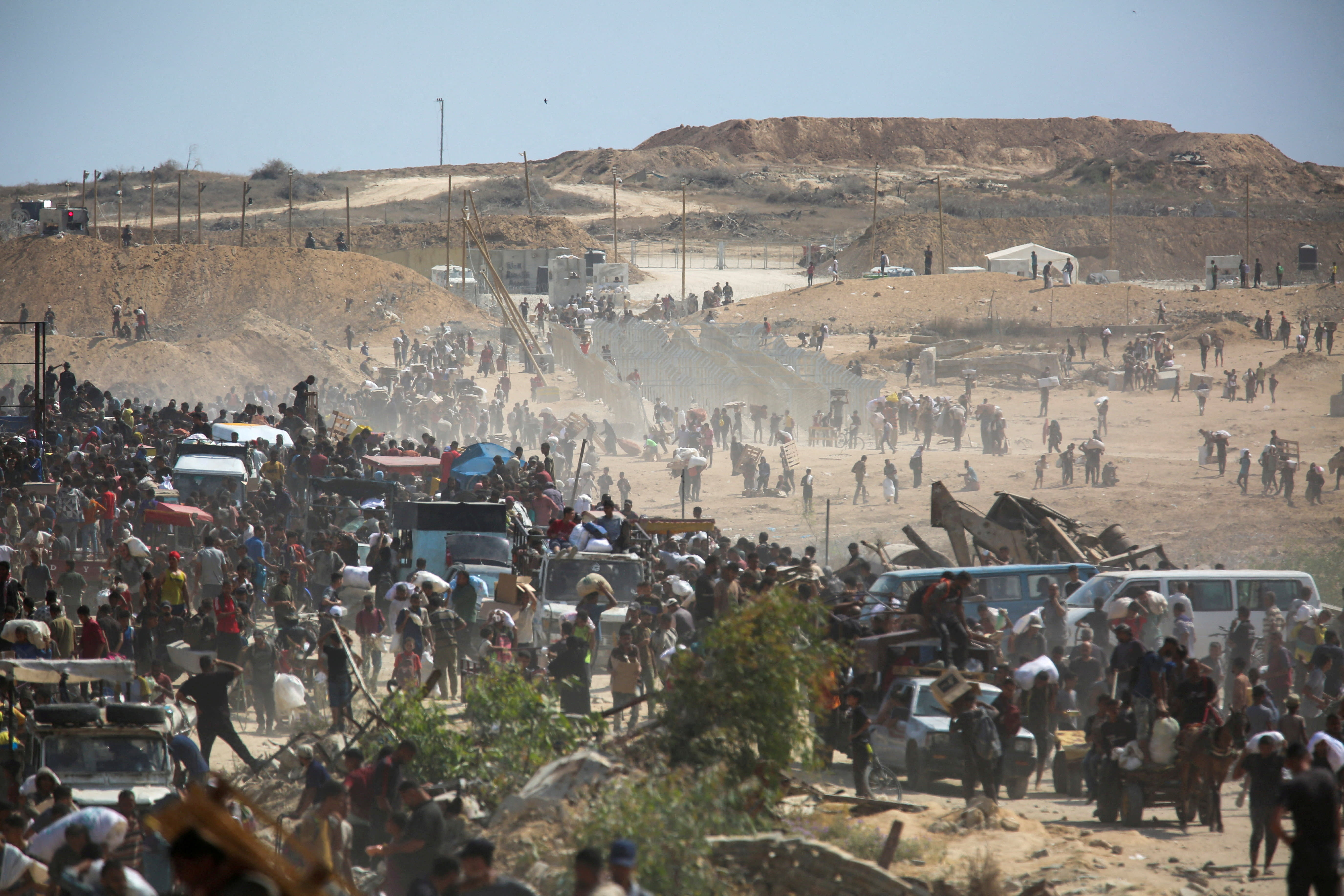 Palestinians seek aid supplies from the US-backed Gaza Humanitarian Foundation (GHF), in the central Gaza Strip, August 4, 2025.  (photo credit: REUTERS/STRINGER/FILE PHOTO)