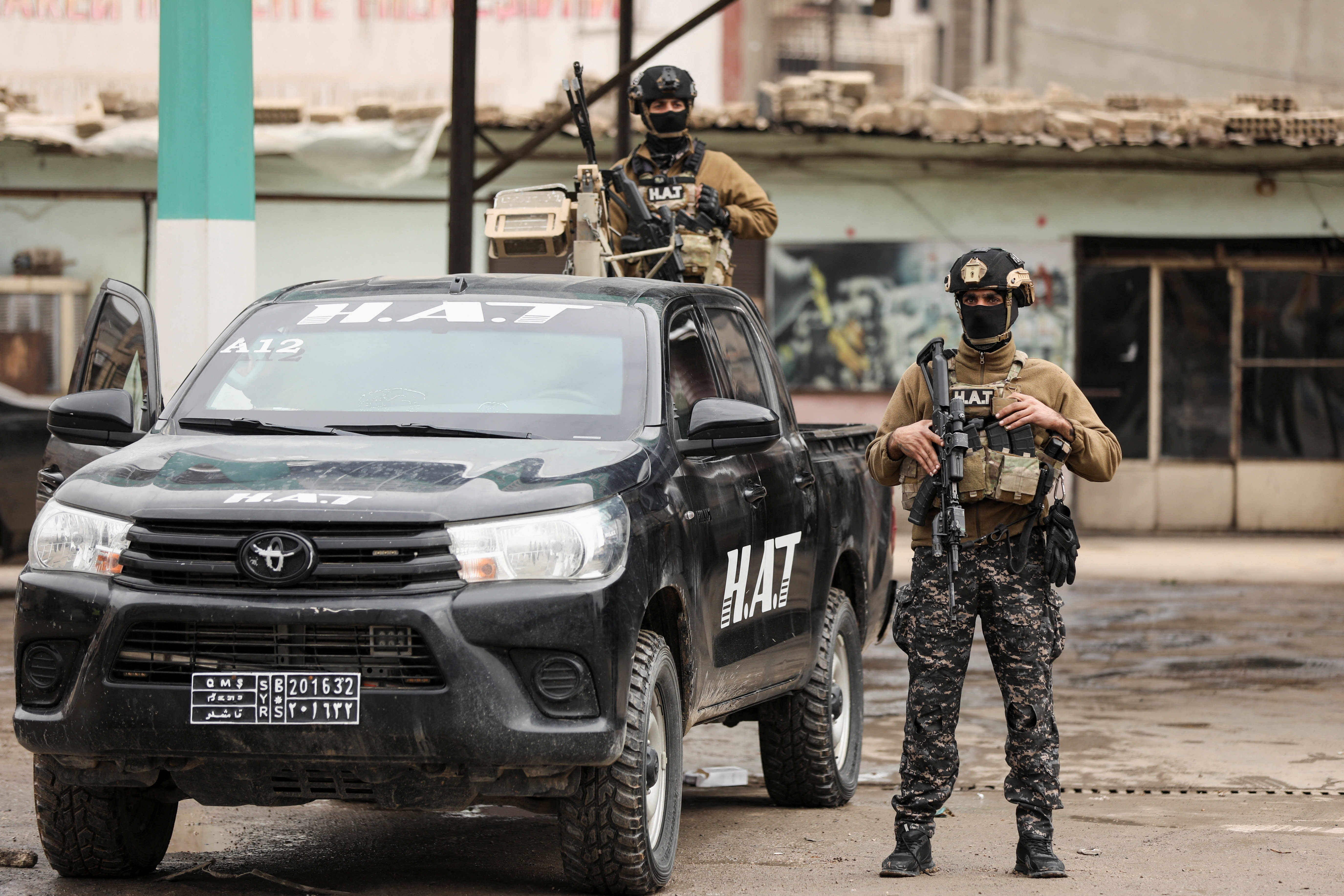 Members of the Kurdish Internal Security Forces wait for the arrival of the security forces of the Syrian government during the curfew, following an agreement between the Syrian Democratic Forces and the Syrian government, in Qamishli, Syria, February 3, 2026. (photo credit: REUTERS/Orhan Qereman)