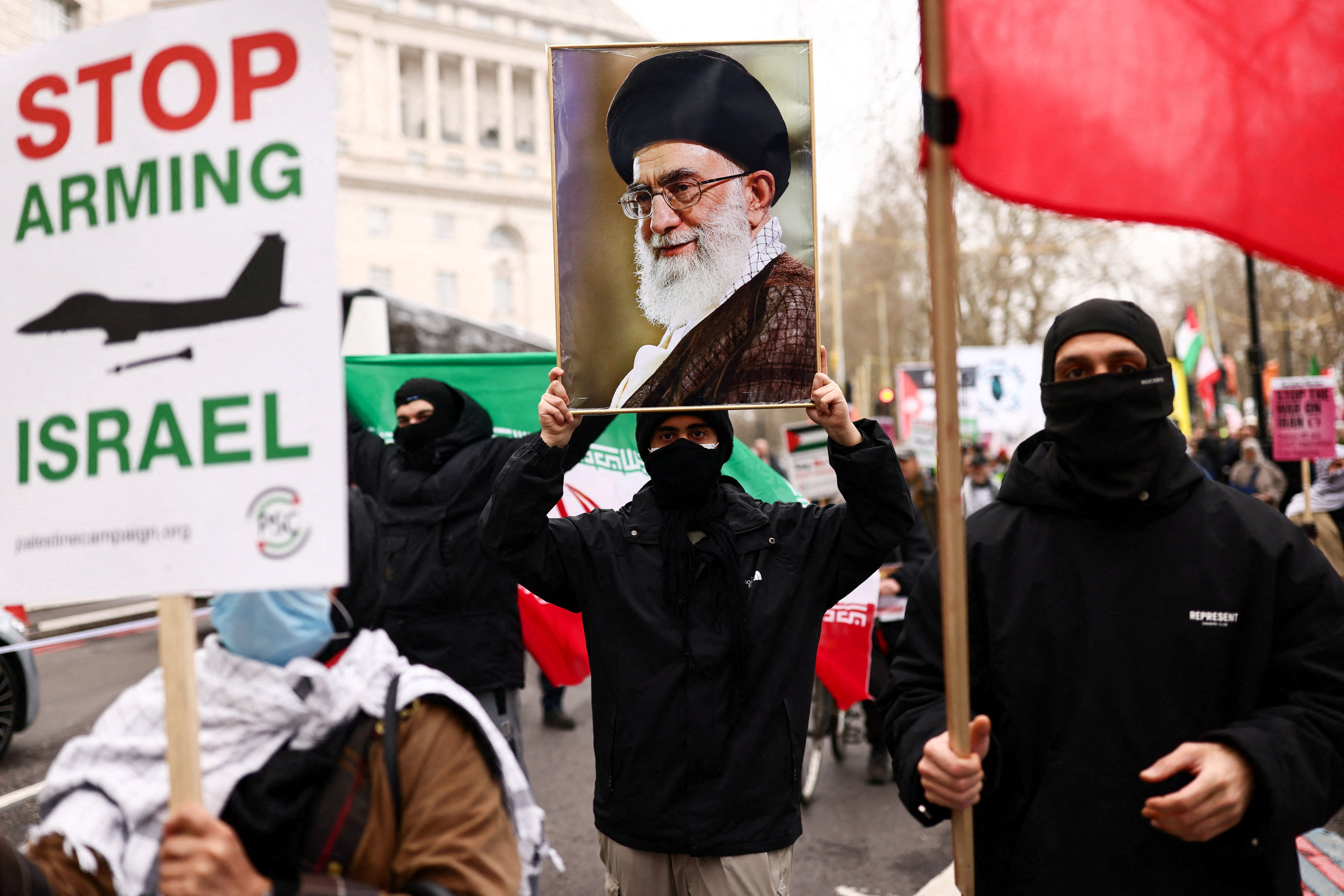 An activist holds an image of Iran