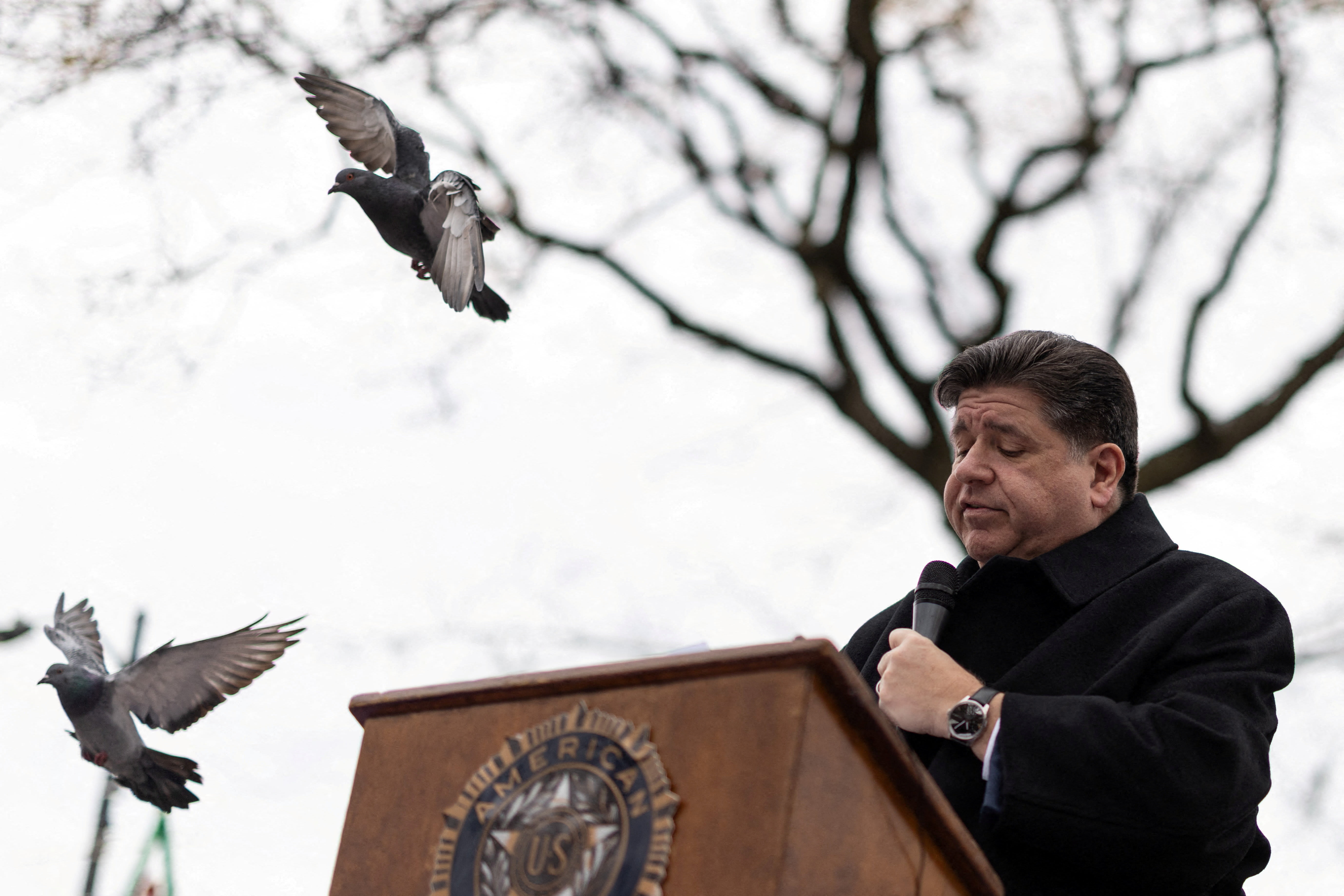 Illinois Governor JB Pritzker pauses as he speaks during a Veterans Day commemoration at the Manuel Perez Jr. Plaza in Chicago, Illinois, U.S., November 11, 2025. (photo credit: REUTERS/CARLOS BARRIA)