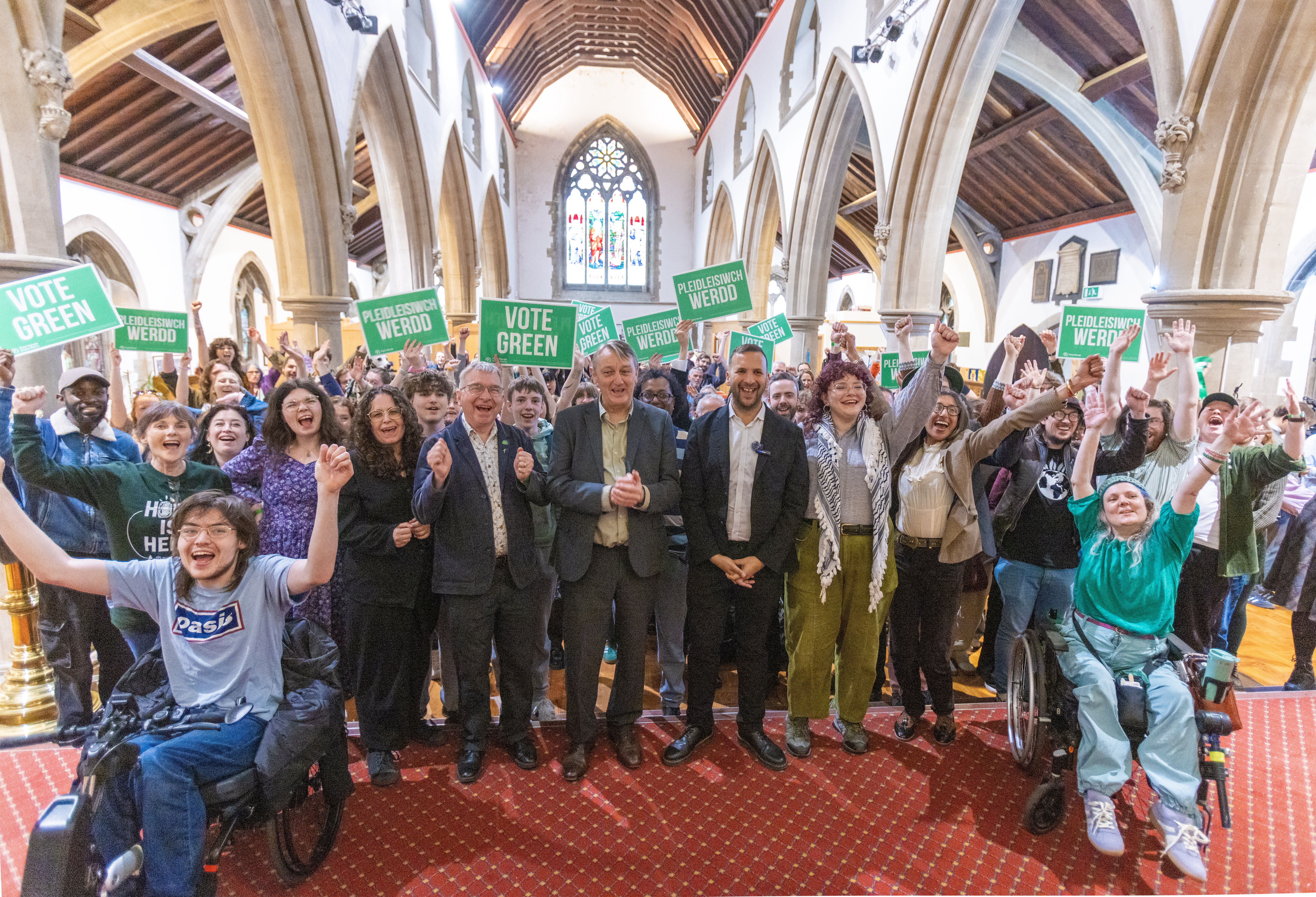 Anthony Slaughter (centre left) and Zack Polanski (centre right), with Green Party activists at a campaign meeting on May 2, 2026 in Cardiff, Wales. (photo credit: Jon Rowley/Getty Images)