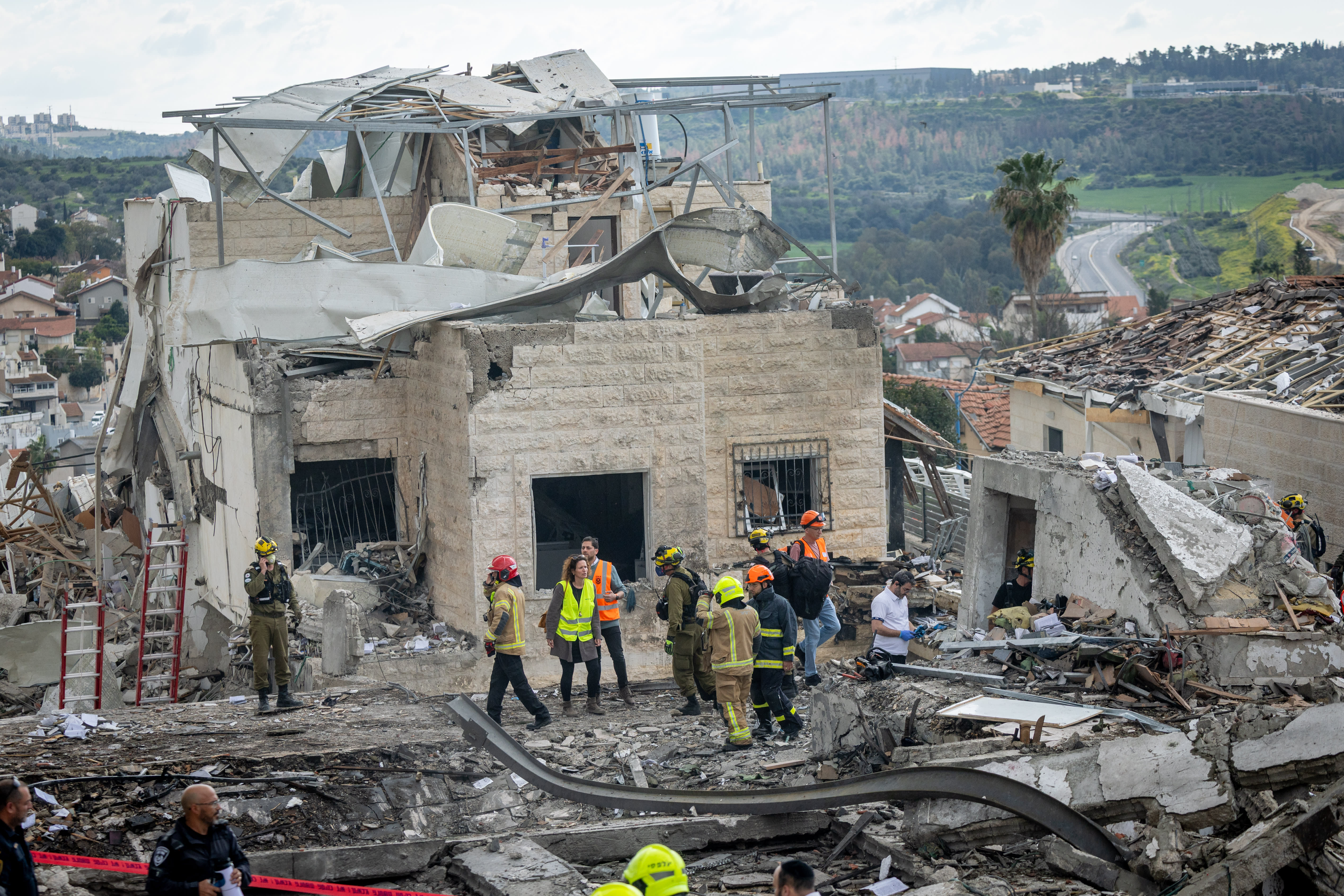 The scene where a ballistic missile fired from Iran hit Bet Shemesh, central Israel, causing heavy damage, March 1, 2026 (photo credit: YONATAN SINDEL/FLASH90)